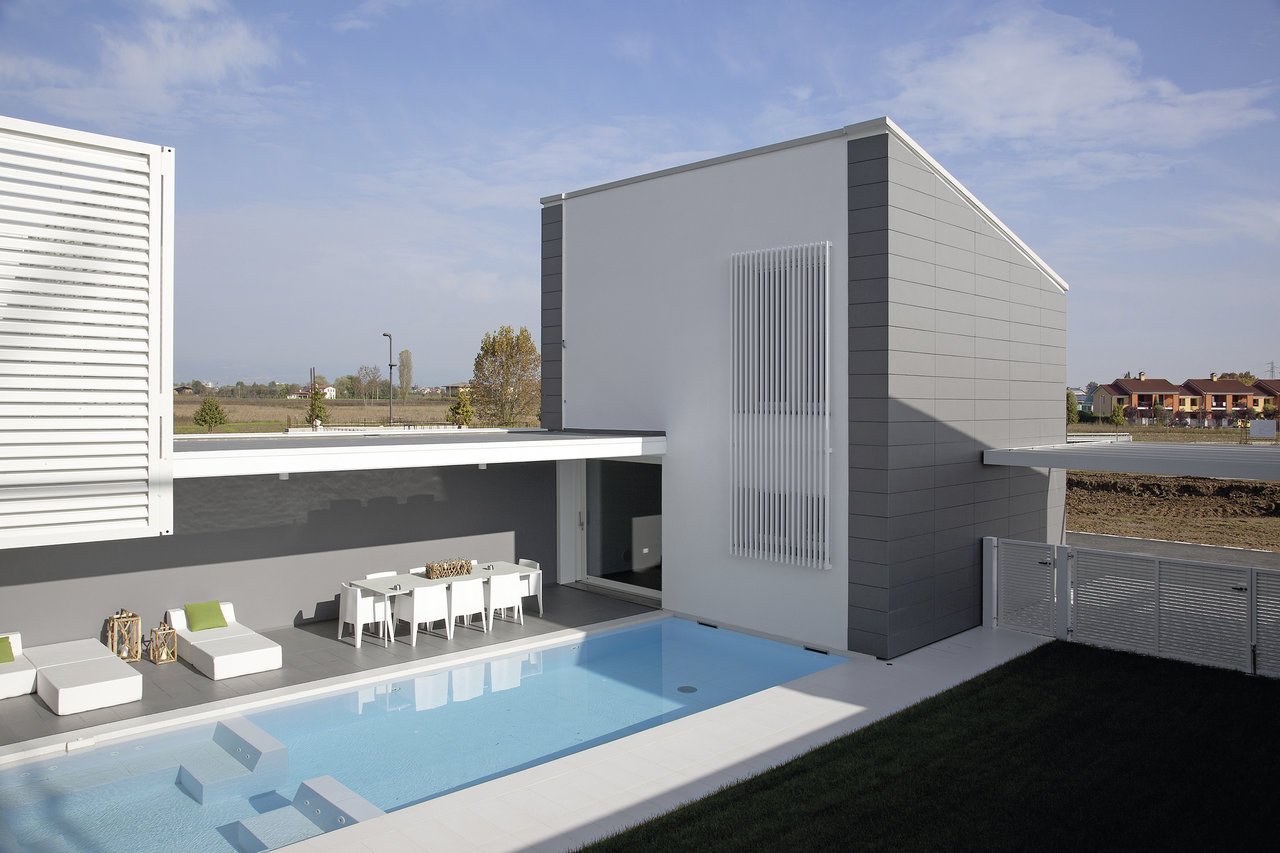 Luxurious pool area with modern terrace and high-quality outdoor tiles.