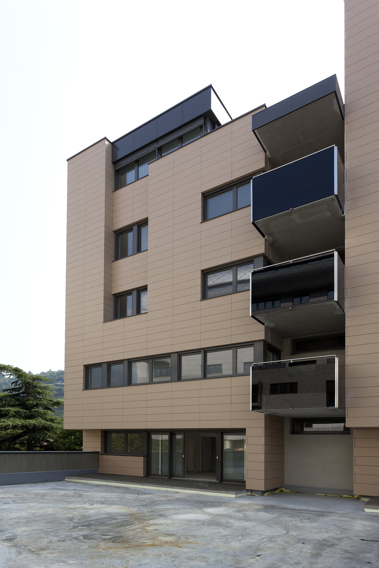 Contemporary building facade with premium beige outdoor tiles.