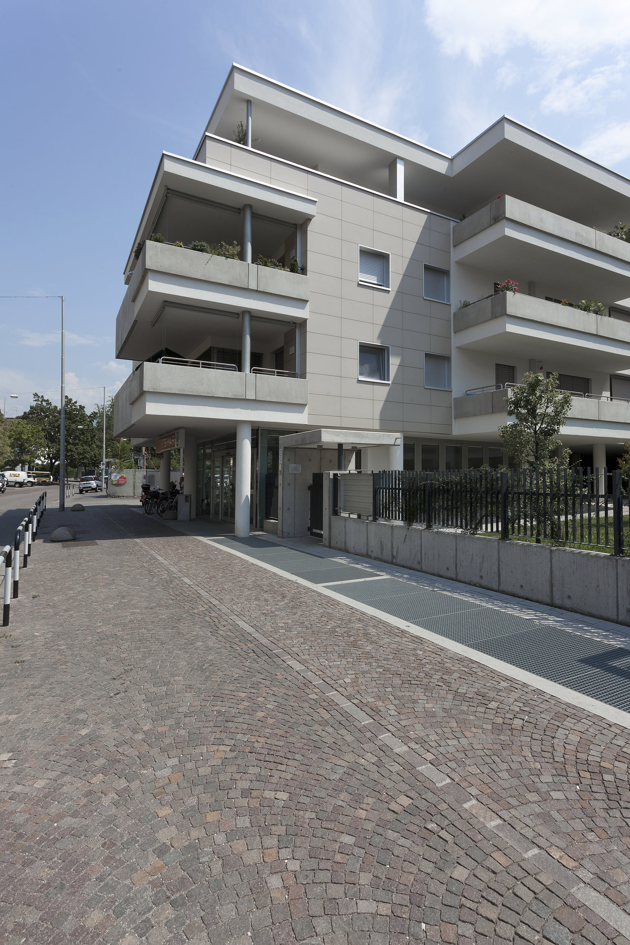 Modern architecture with a bright tile facade and an inviting outdoor area.