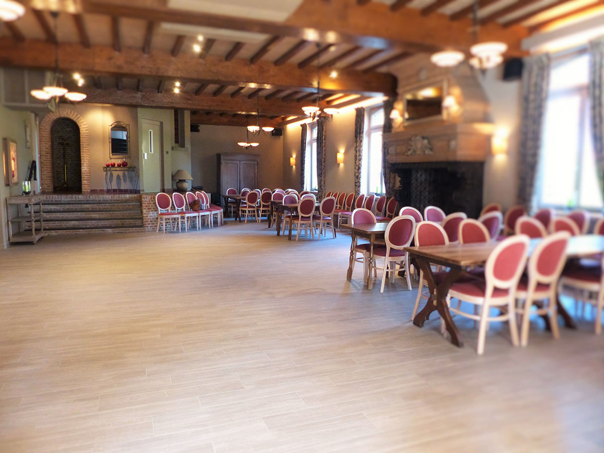 Stylish light wood or concrete effect tiles in a ballroom.