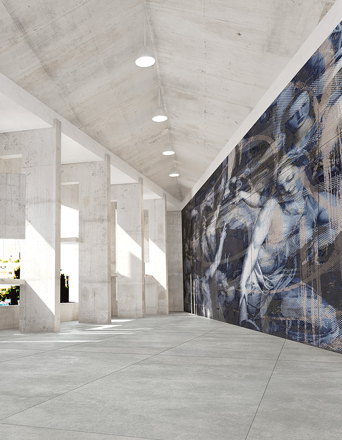 Artistic blue-brown figured wall tiles paired with light grey concrete-look floor tiles.