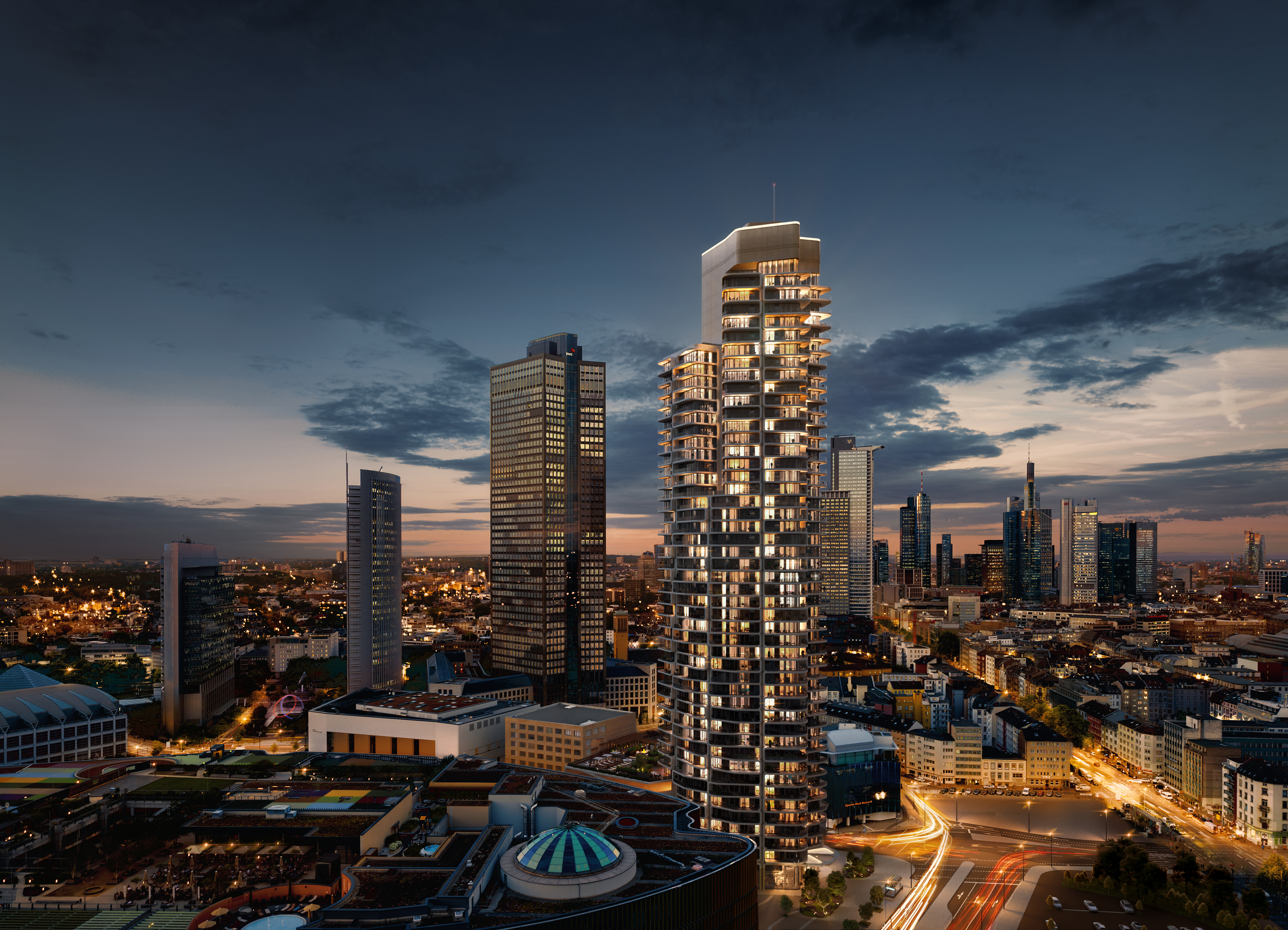 Modern city skyline at dusk with an illuminated residential high-rise.