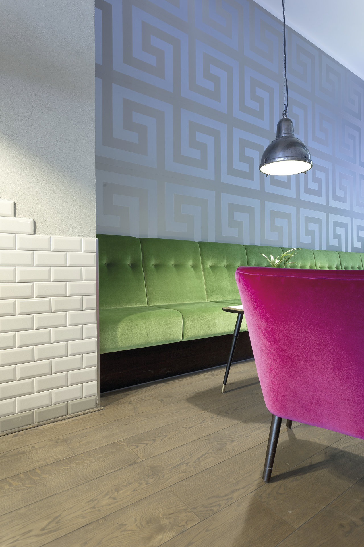 Modern ambiance with wood-look floor tiles and white subway tiles.