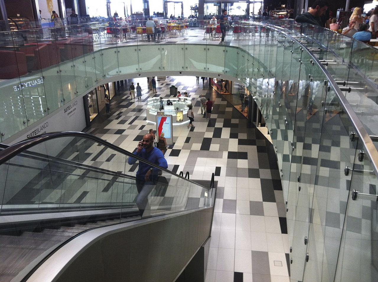 Modern tiled floor with geometric pattern in black, white, and grey.