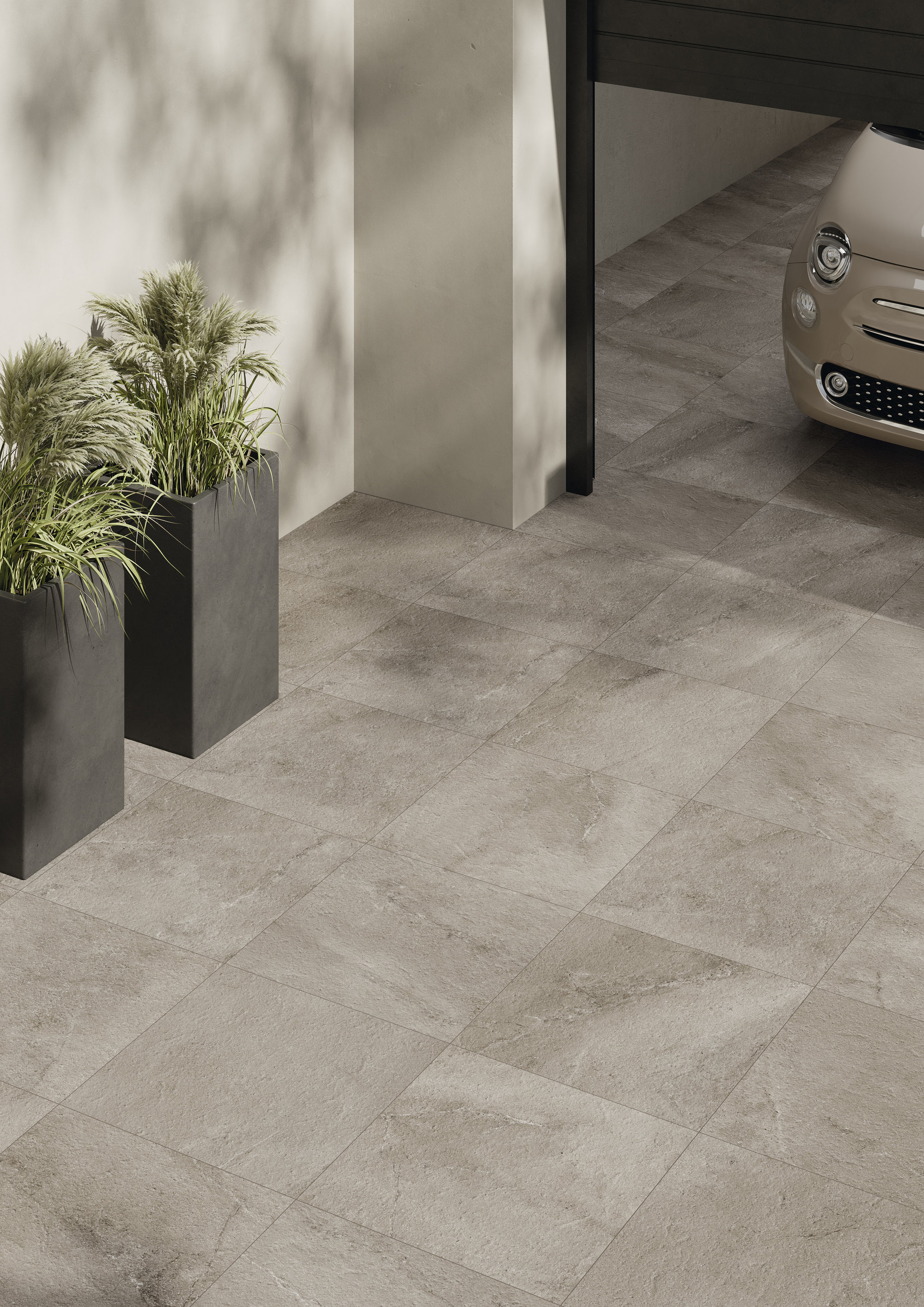 Light, durable concrete-effect outdoor tiles for driveways and patios.