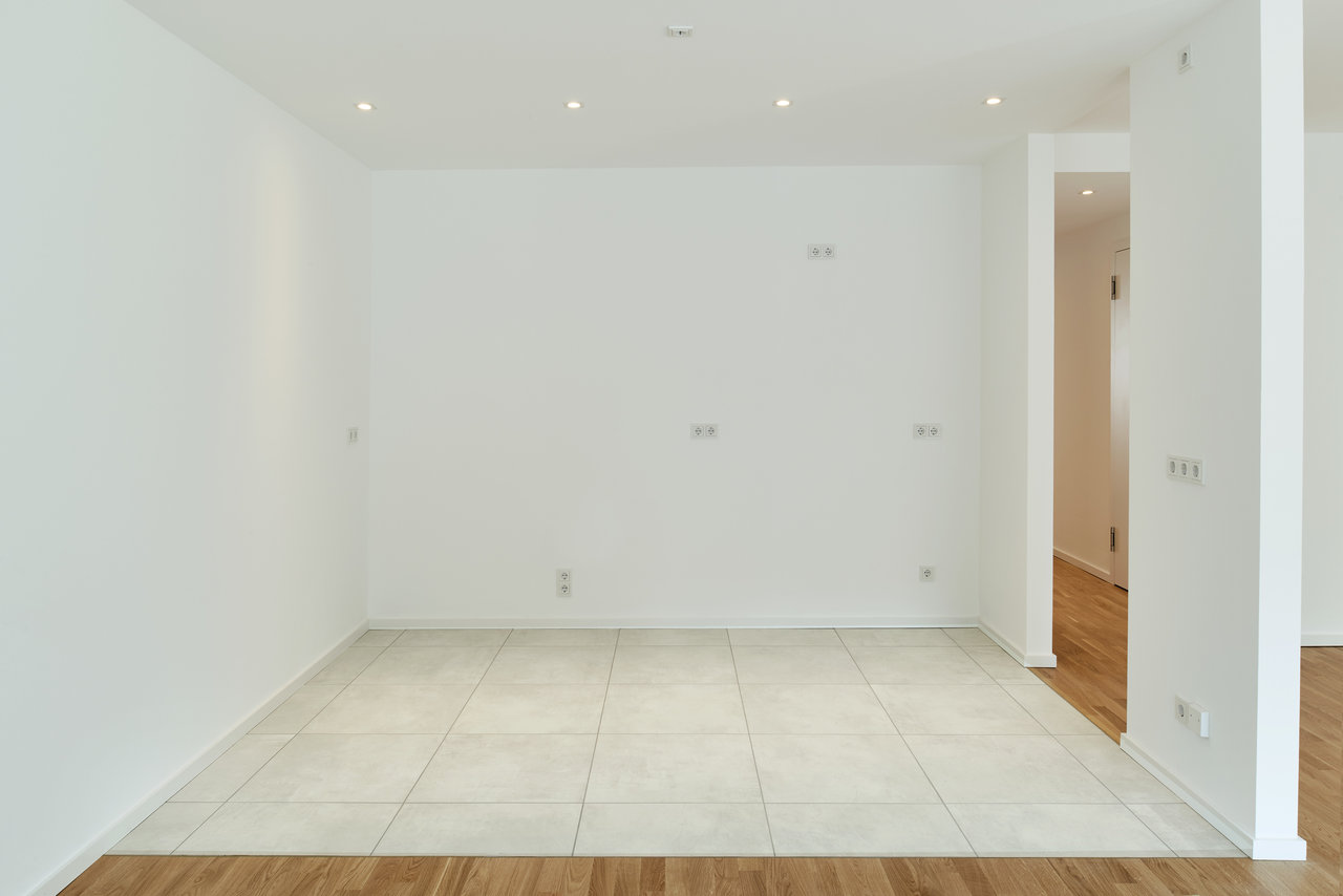 Modern, bright indoor tiles combined with wooden flooring.