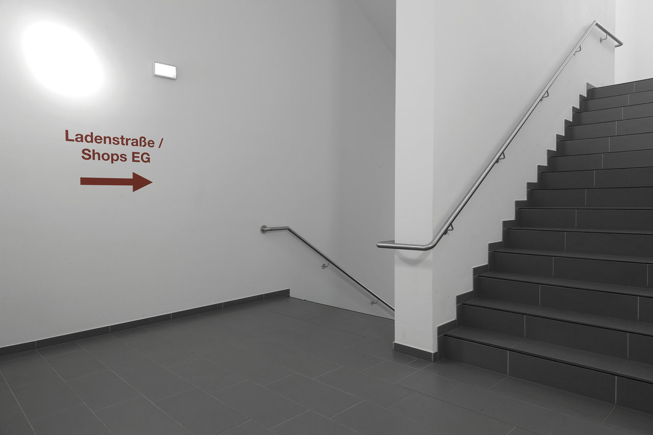 Premium dark grey floor & stair tiles, contemporary design.