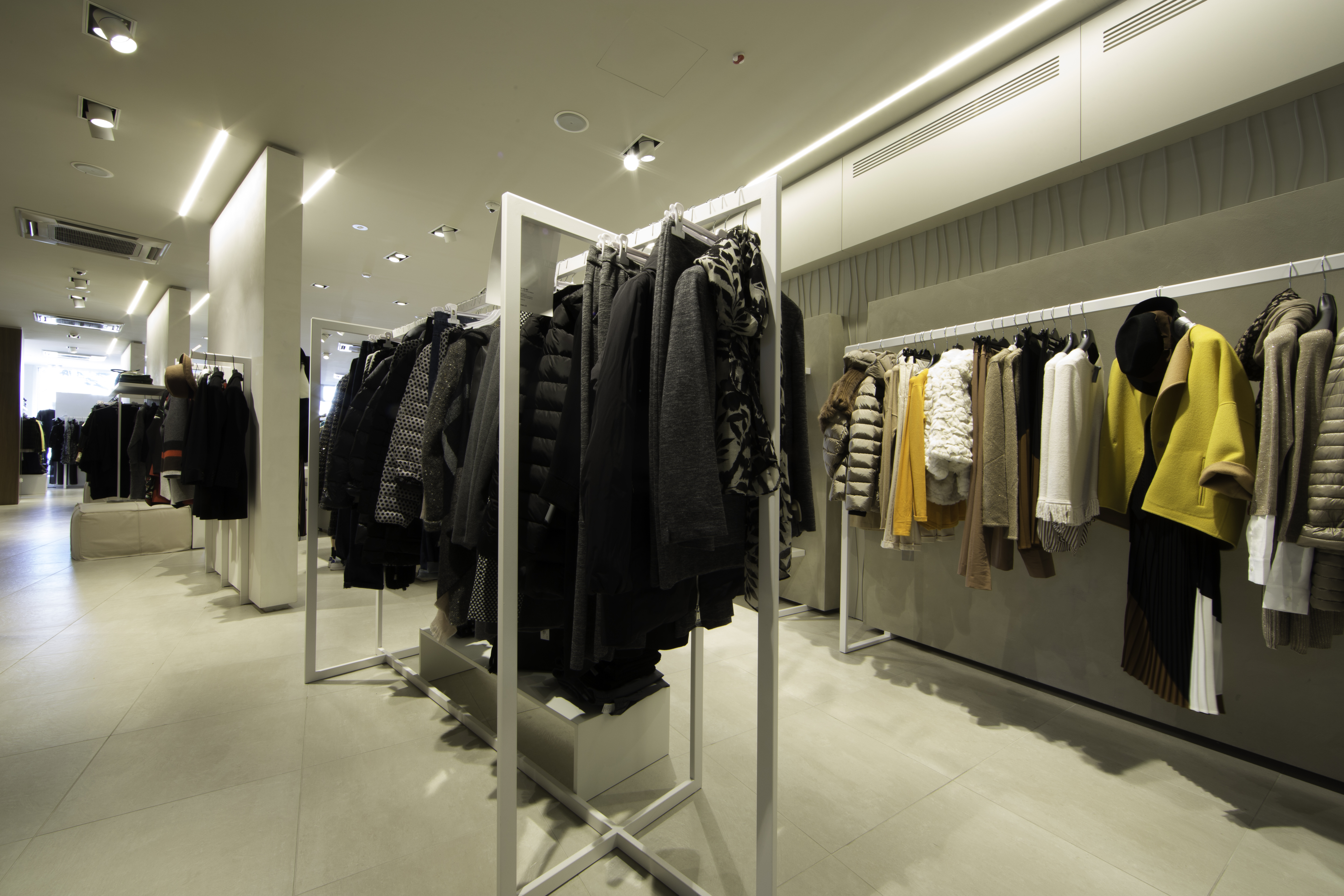 Modern shop with bright, large-format tiled floor.
