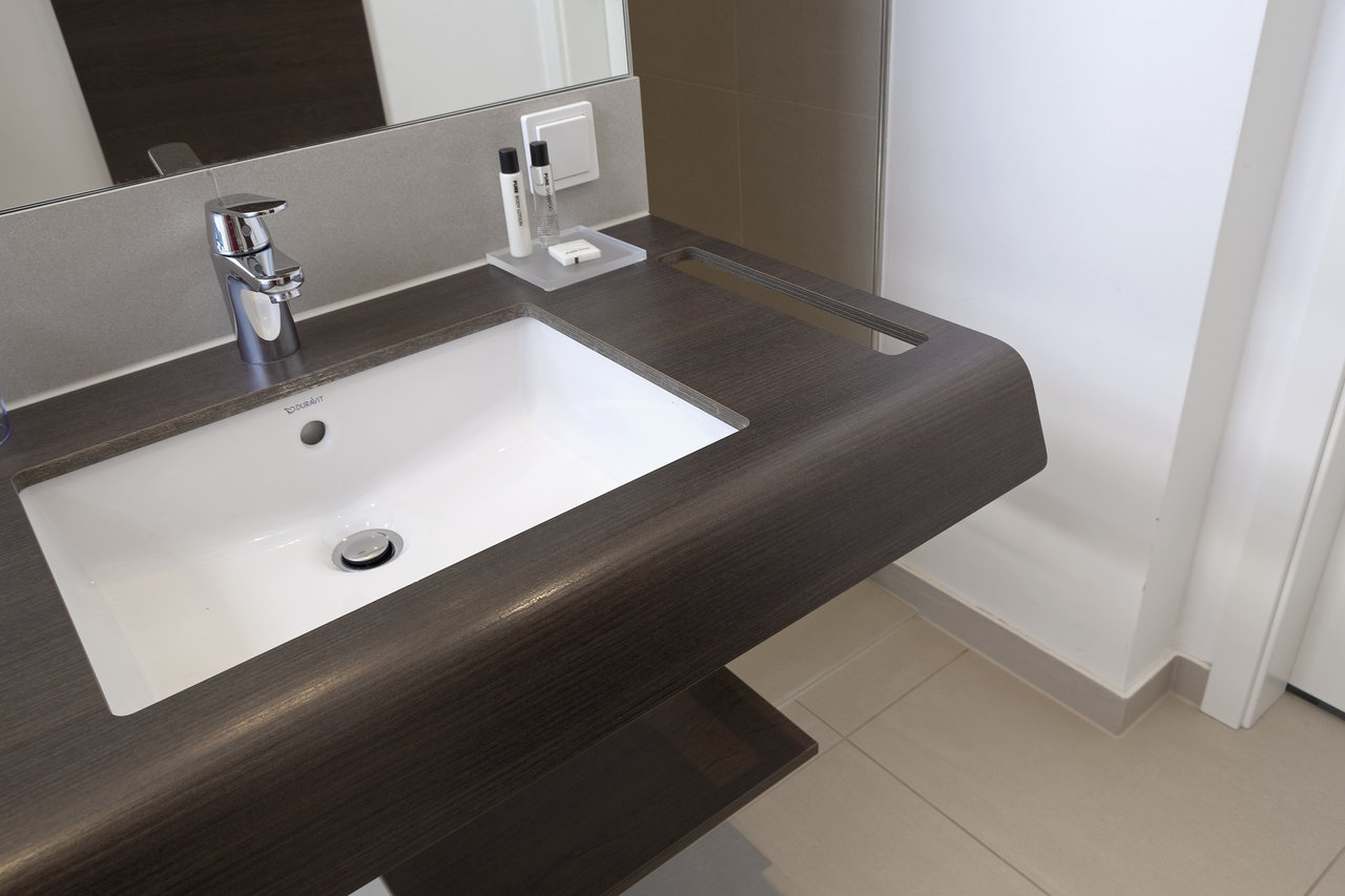 High-quality light floor tiles in a modern bathroom.