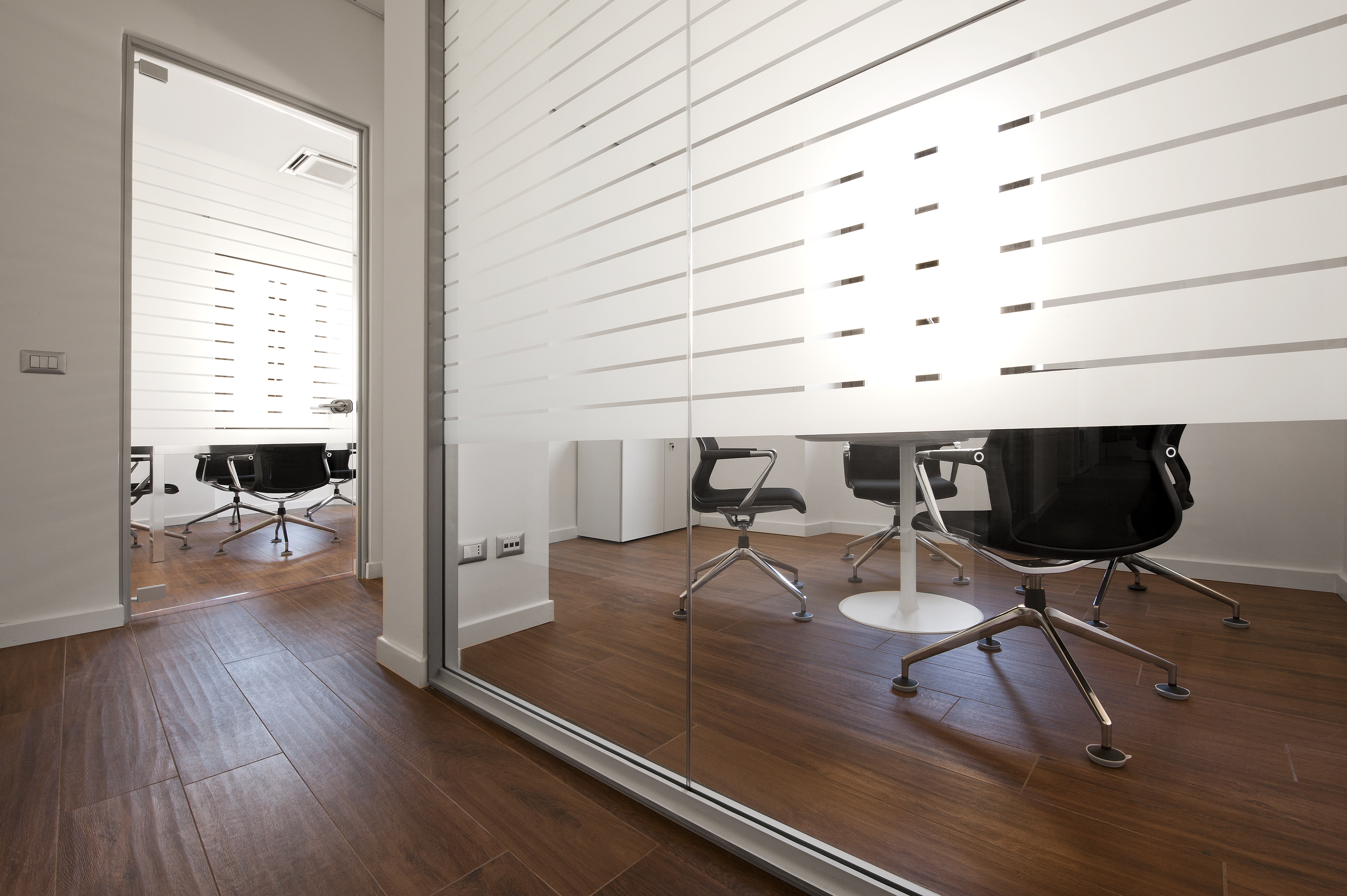 Dark wood-look tiles in a modern office.