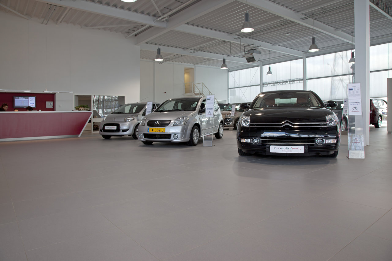 Bright, large-format floor tiles in a modern showroom.