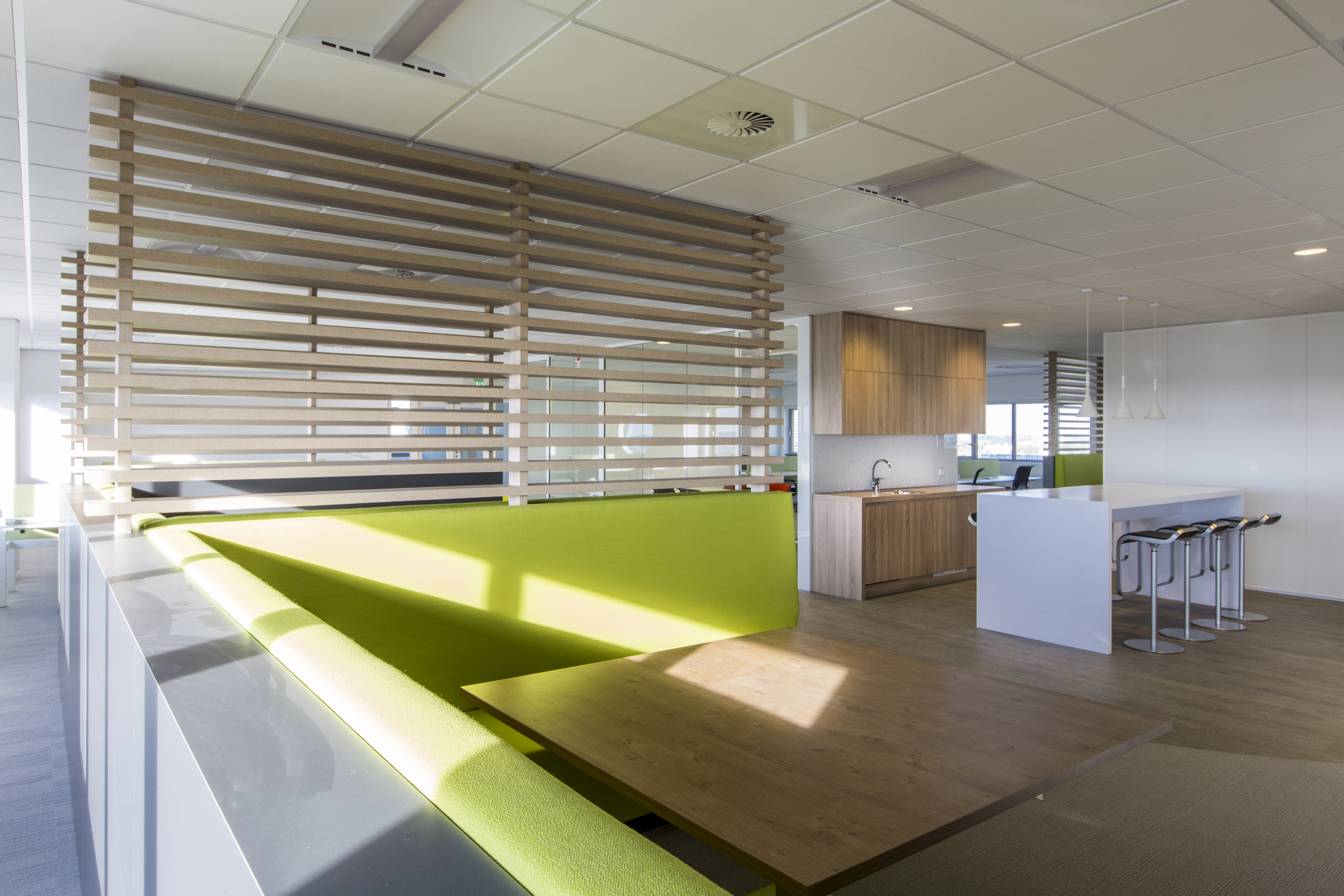 Contemporary office interior with high-quality wood-effect floor tiles.