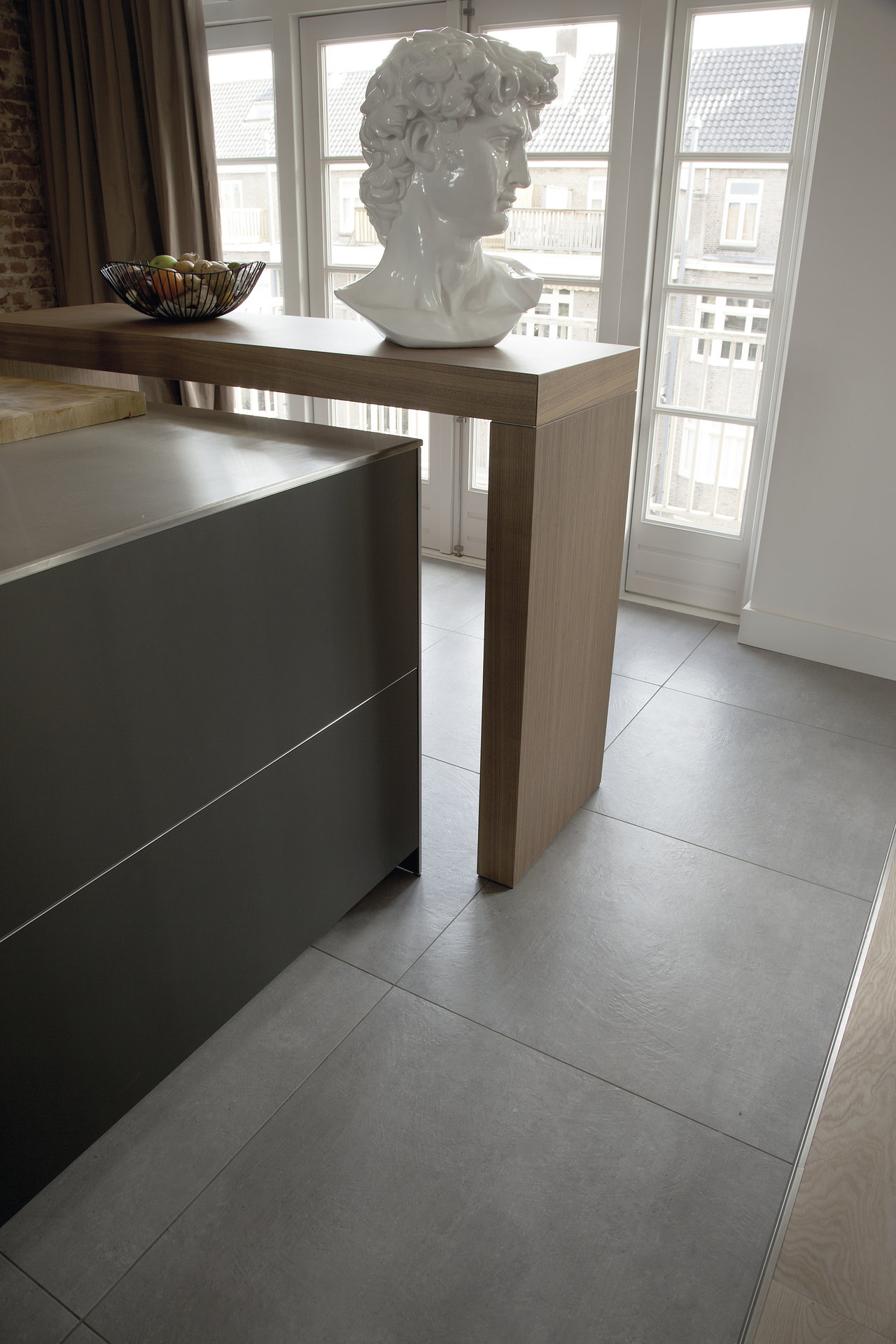 Modern, large-format grey concrete-effect floor tiles for a stylish home.
