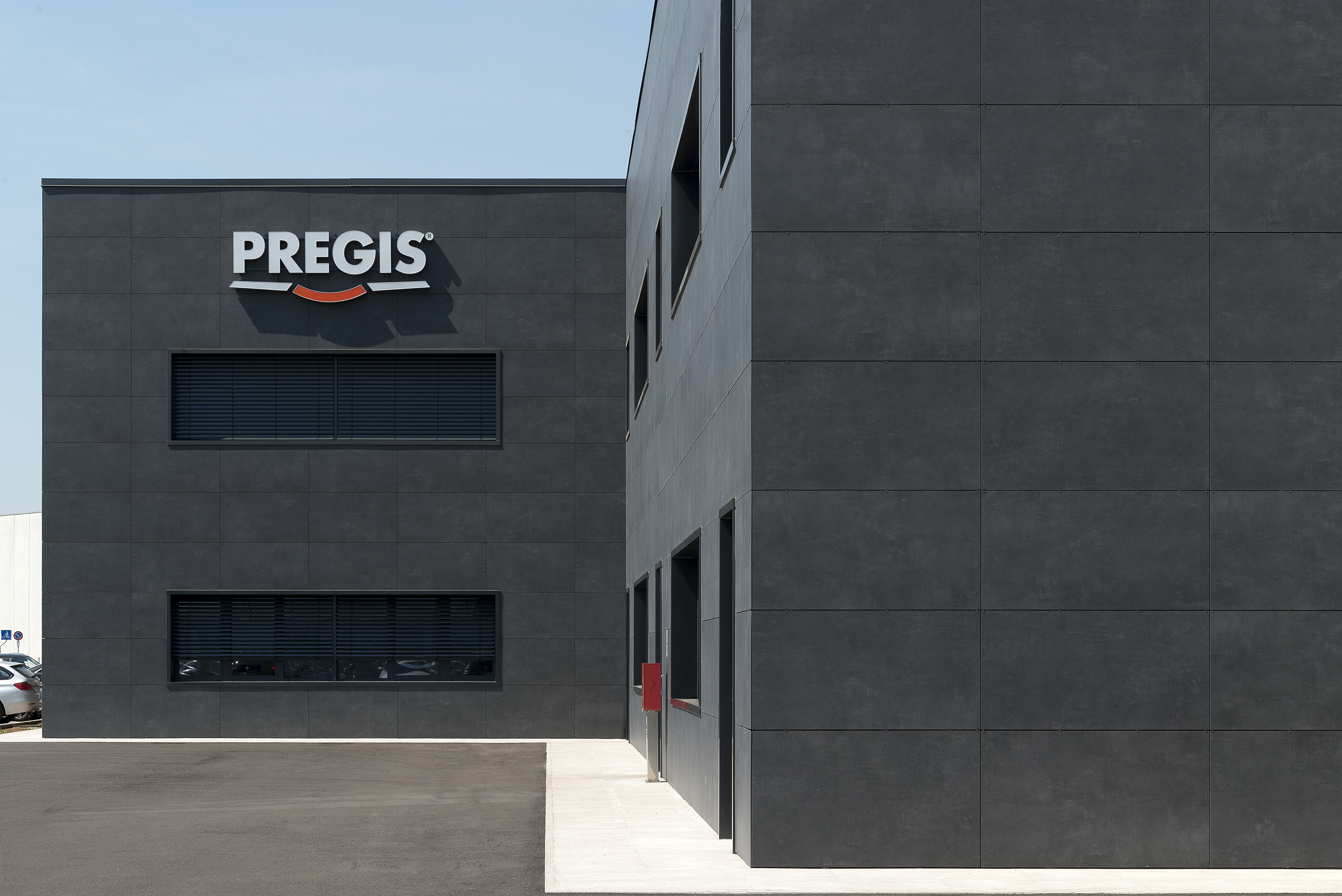 Modern building with high-quality, dark facade tiles.