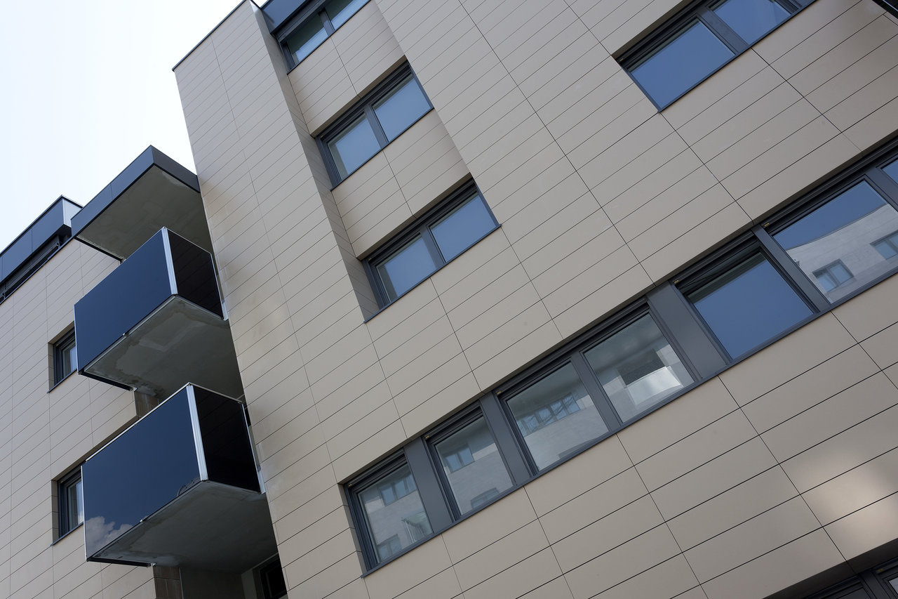 Modern building facade with light outdoor tiles.
