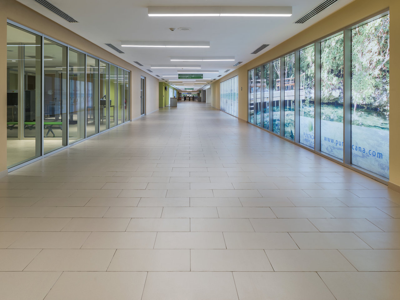 Modern, bright floor tiles in a spacious, sunlit hallway.