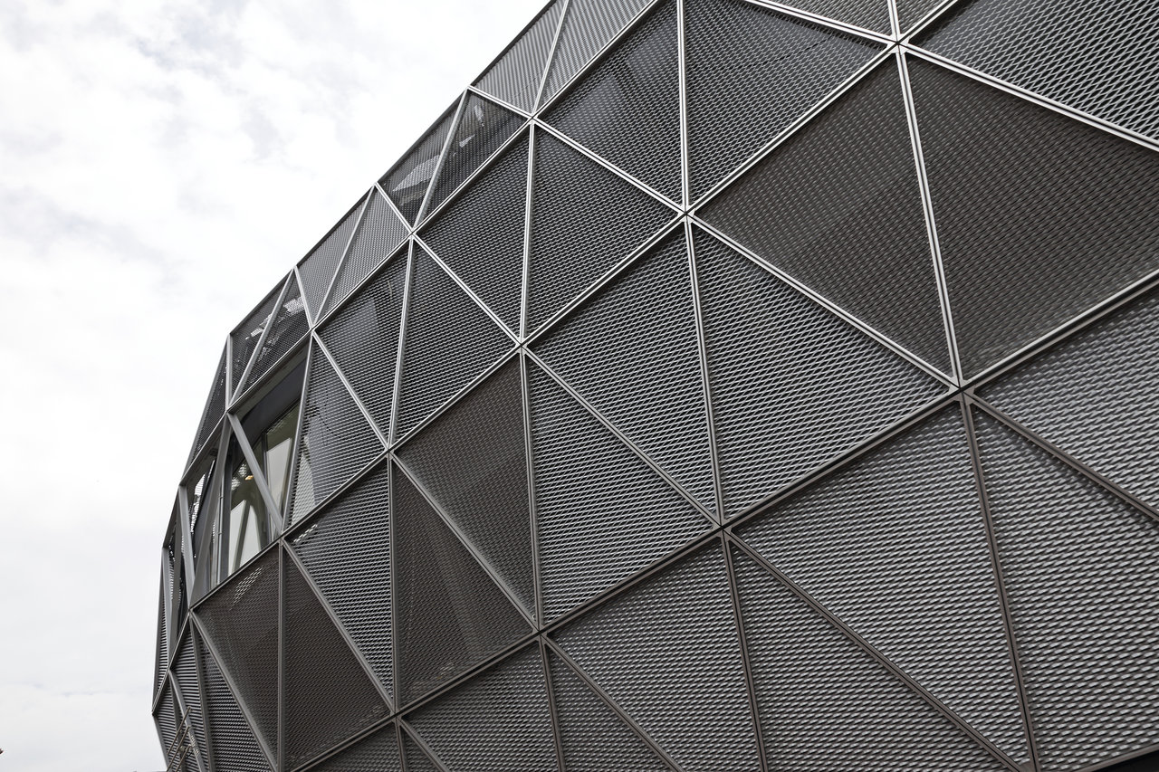 Modern Architecture: Facade with triangular metal grilles.
