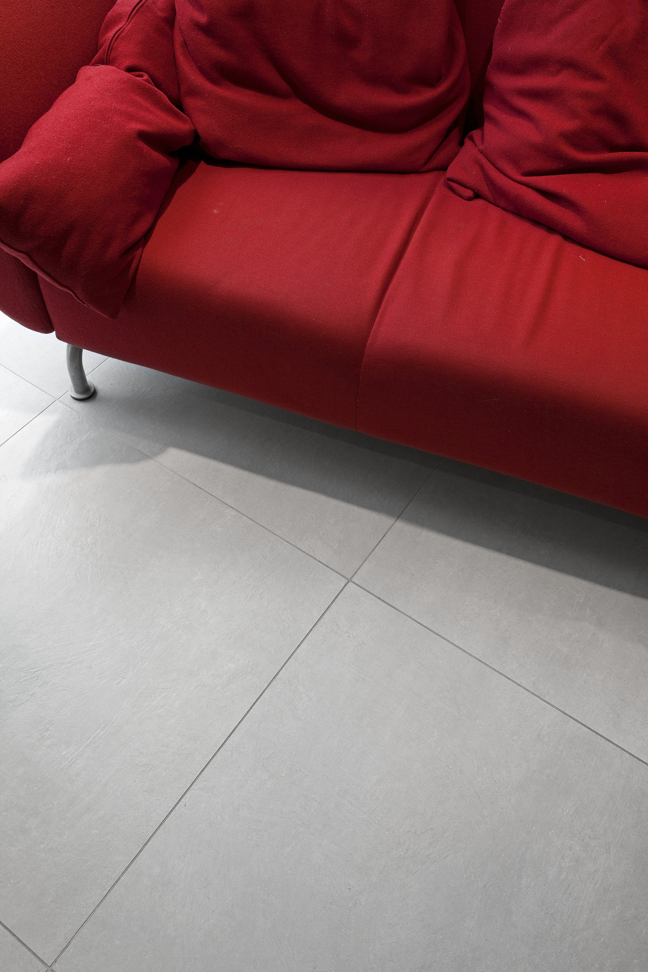 Modern, light grey floor tiles for living areas.
