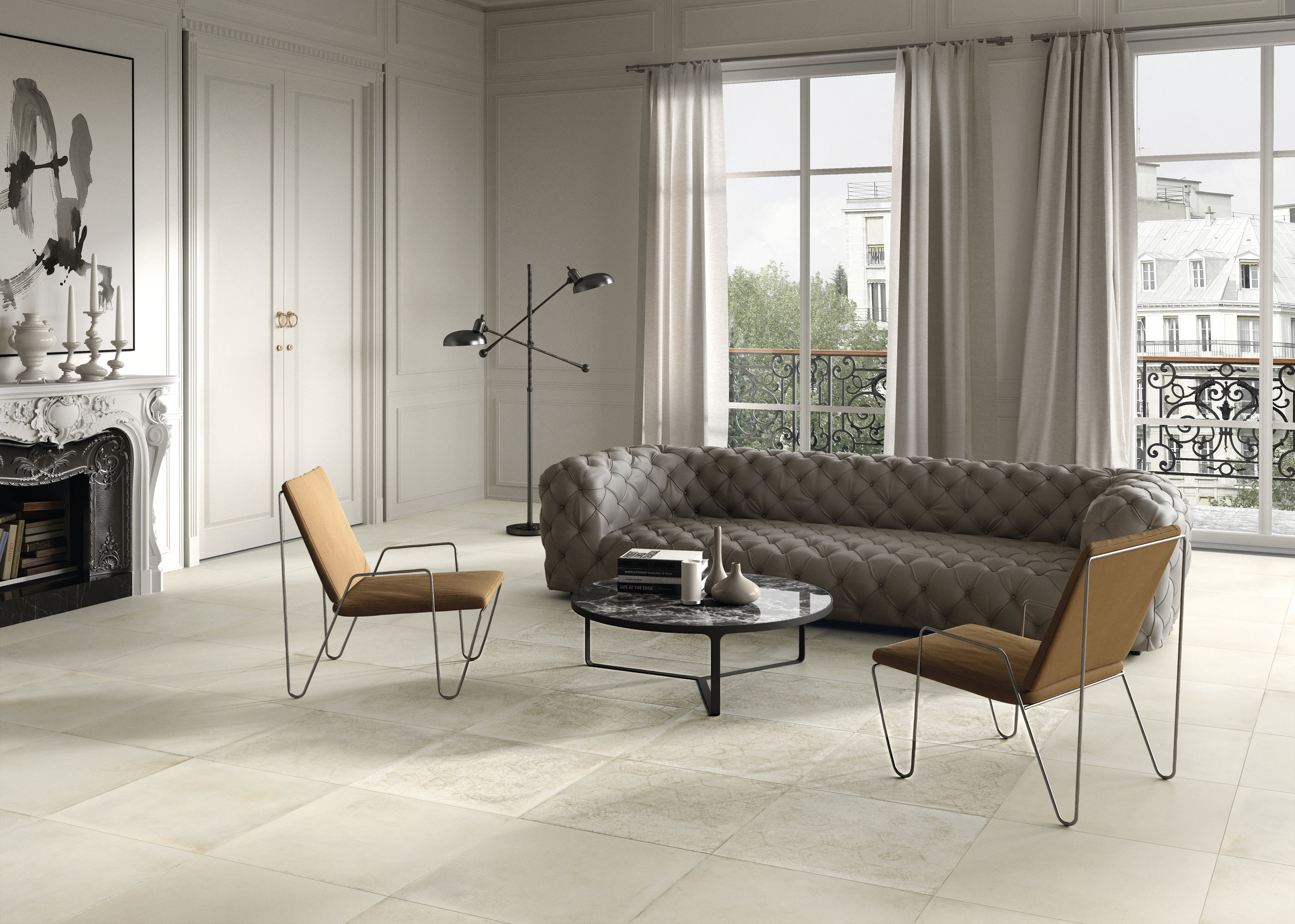 Light, large-format tiles in an elegant living room with a stylish sofa and fireplace.