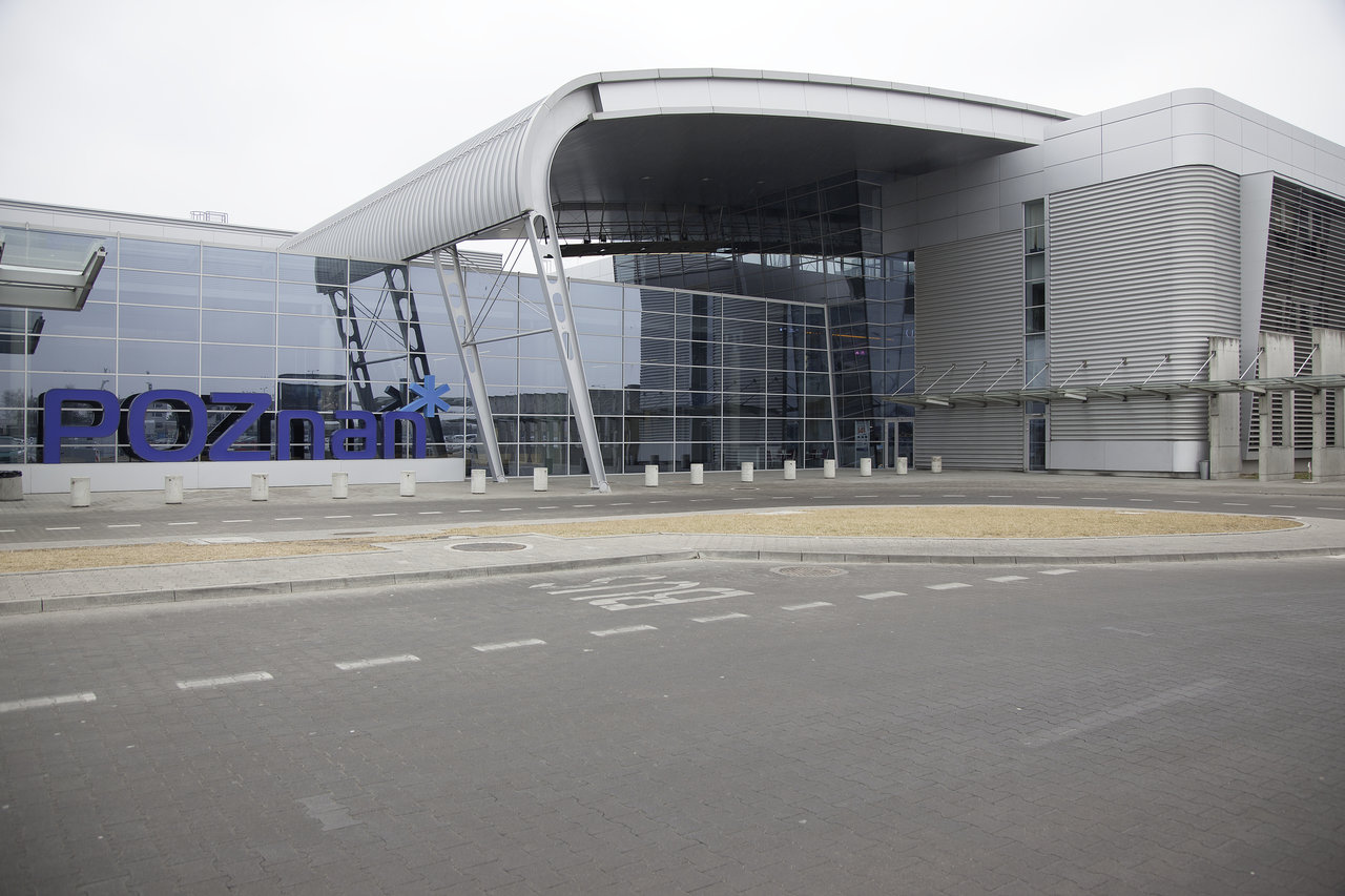 Modern building with glass facade and the inscription POZnan.