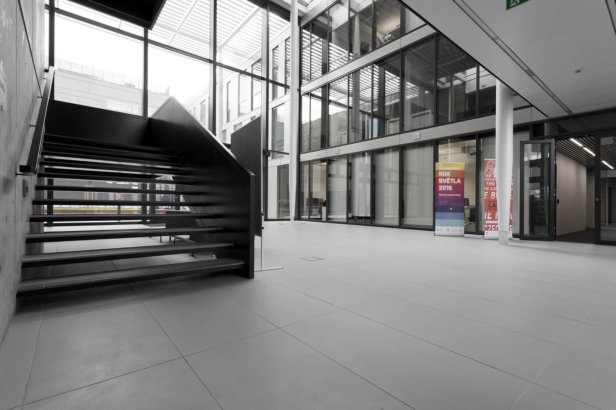 Premium light grey indoor tiles for a modern entrance.
