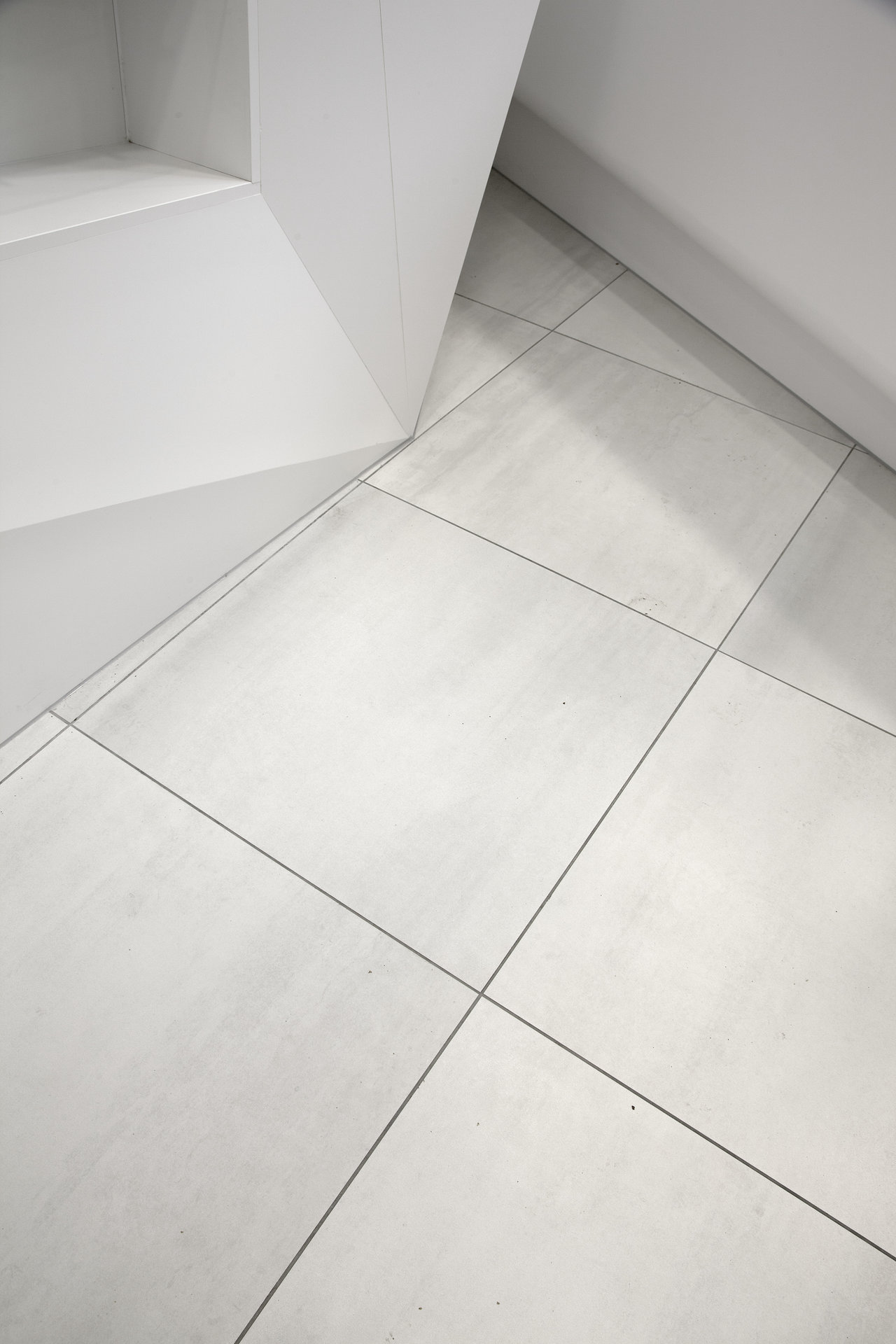 Light, modern large-format floor tiles for stylish interiors.
