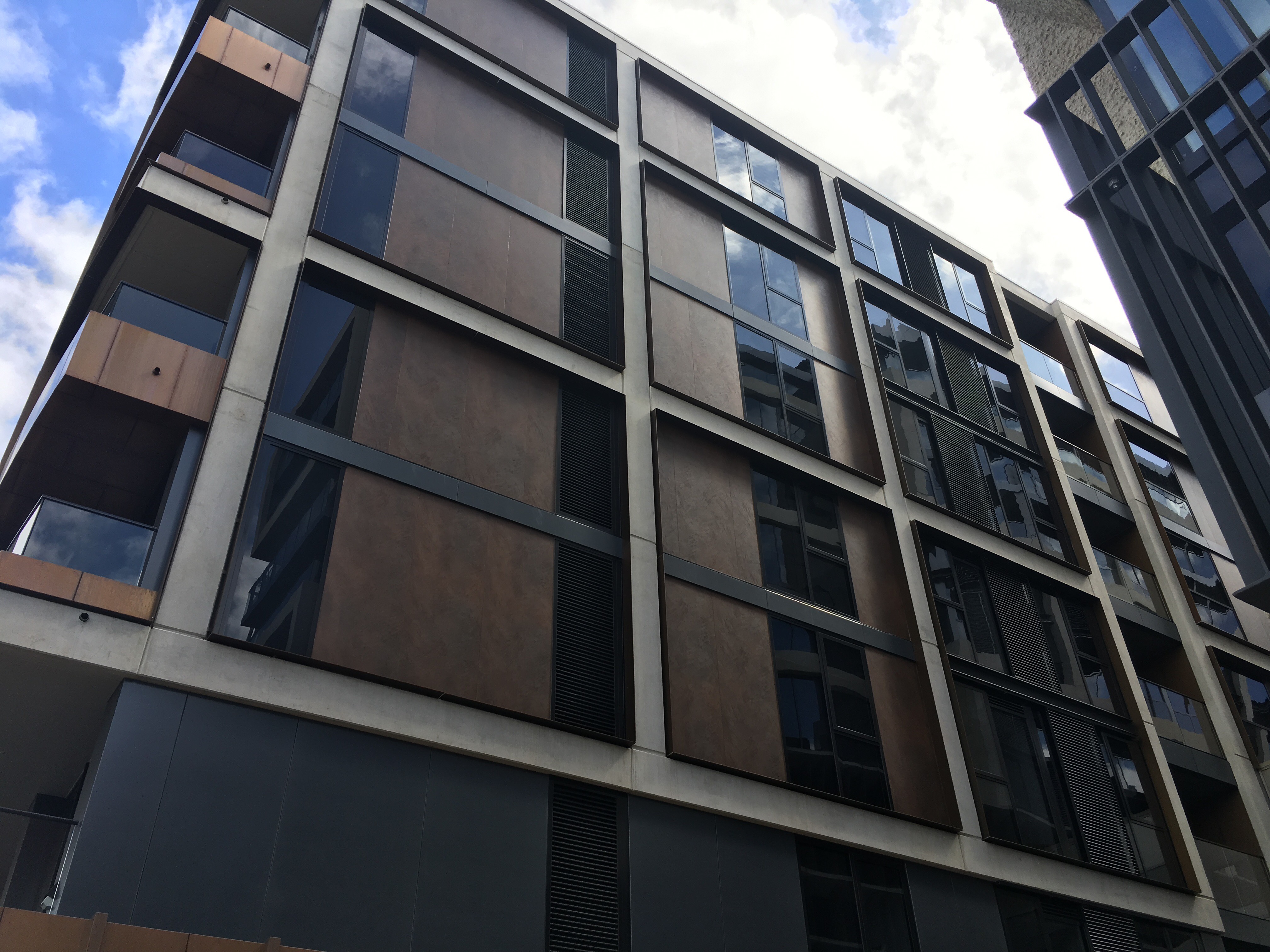 Modern facade cladding with large-format outdoor tiles.
