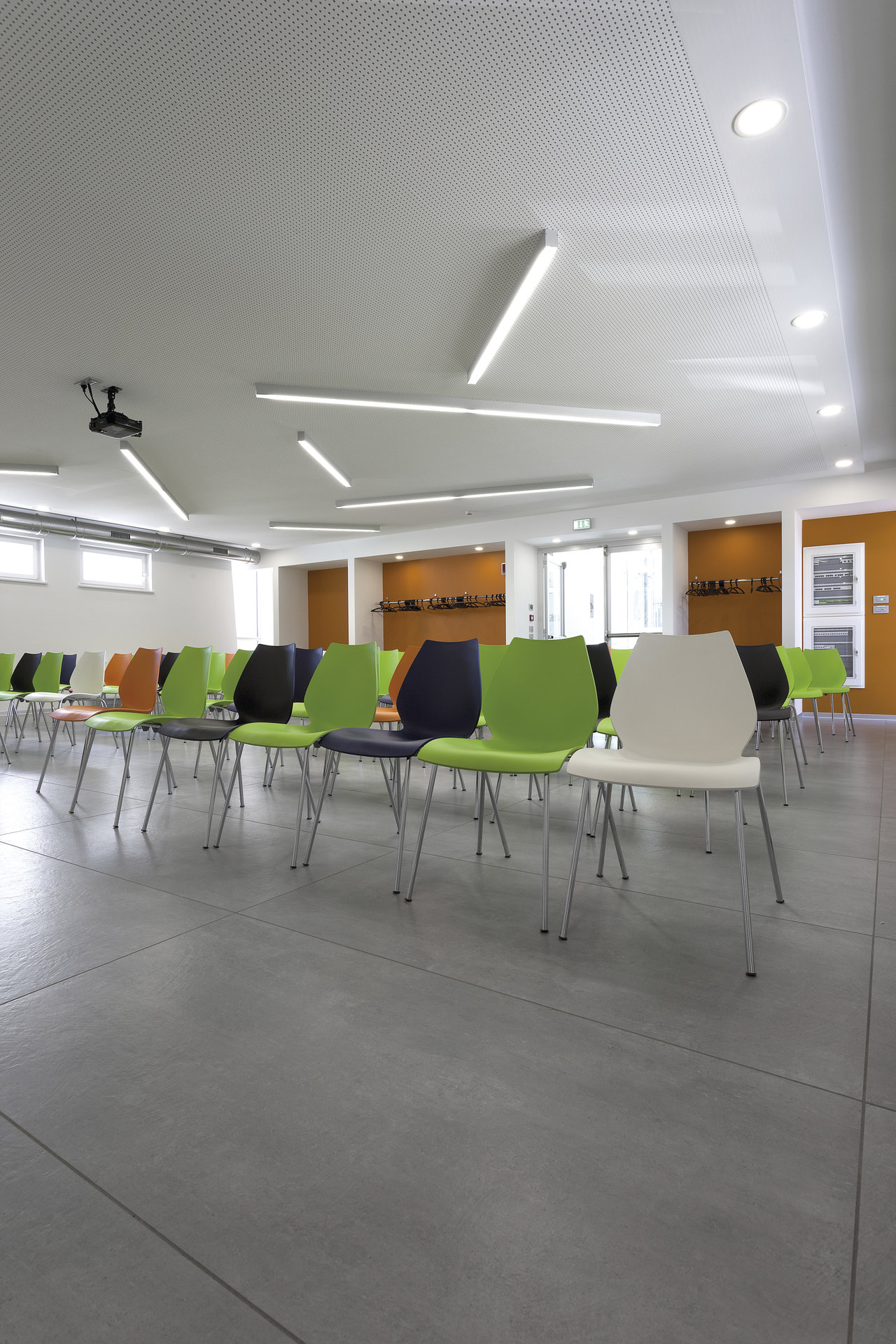 Grey concrete-effect tiled floor in a modern room.