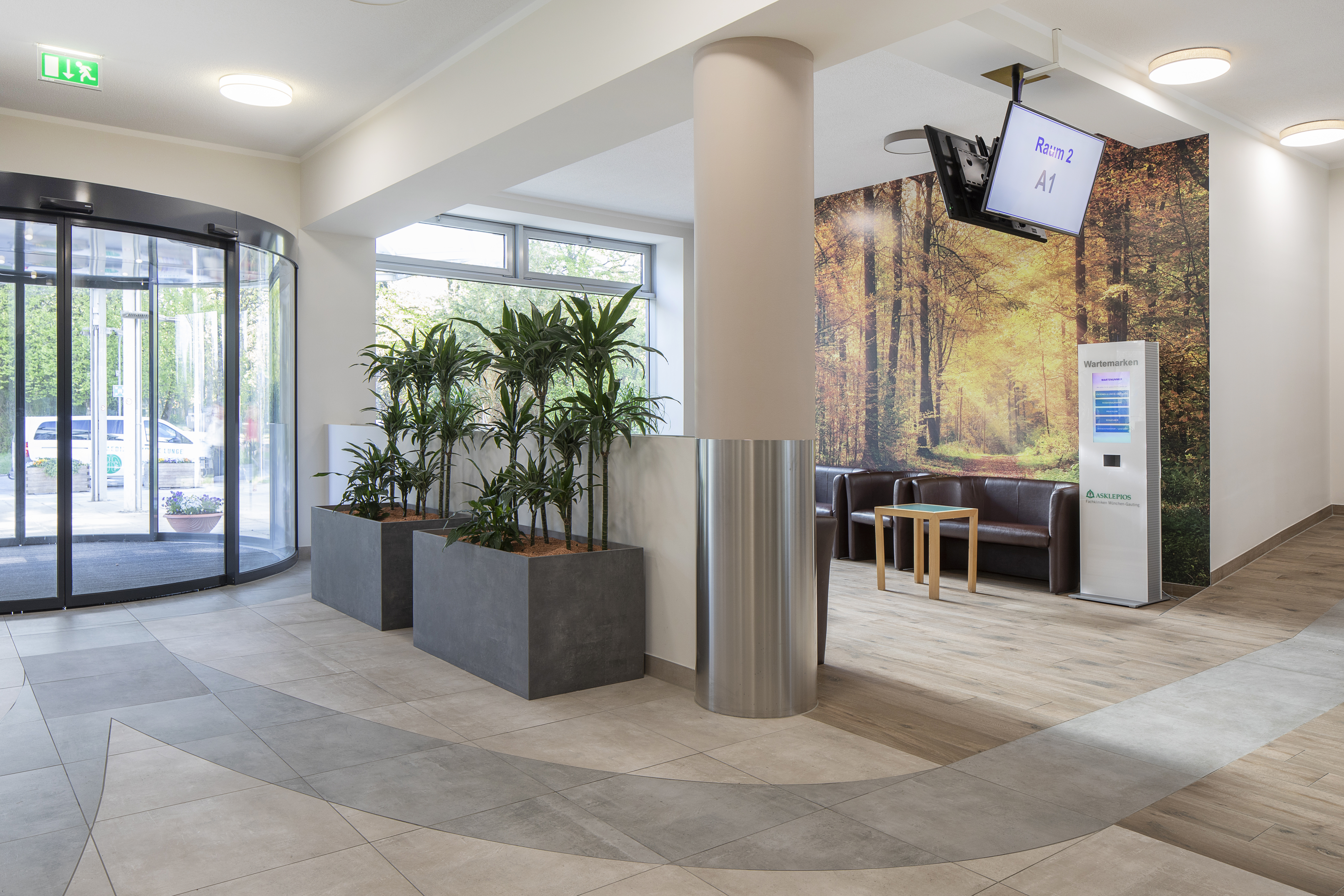 Modern reception area with stylish wood and concrete look tiles.