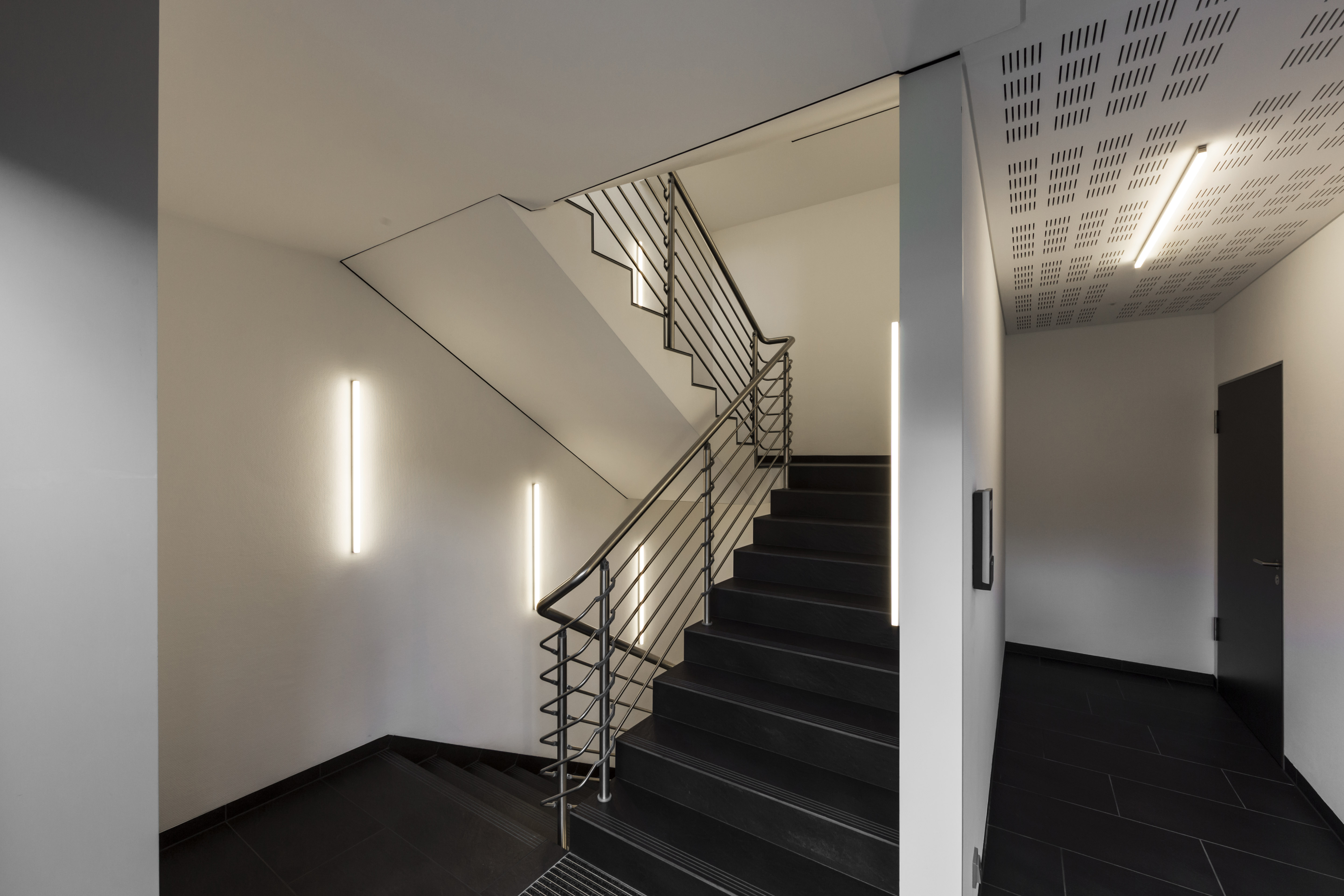 Dark Porcelaingres tiles in a modern staircase.