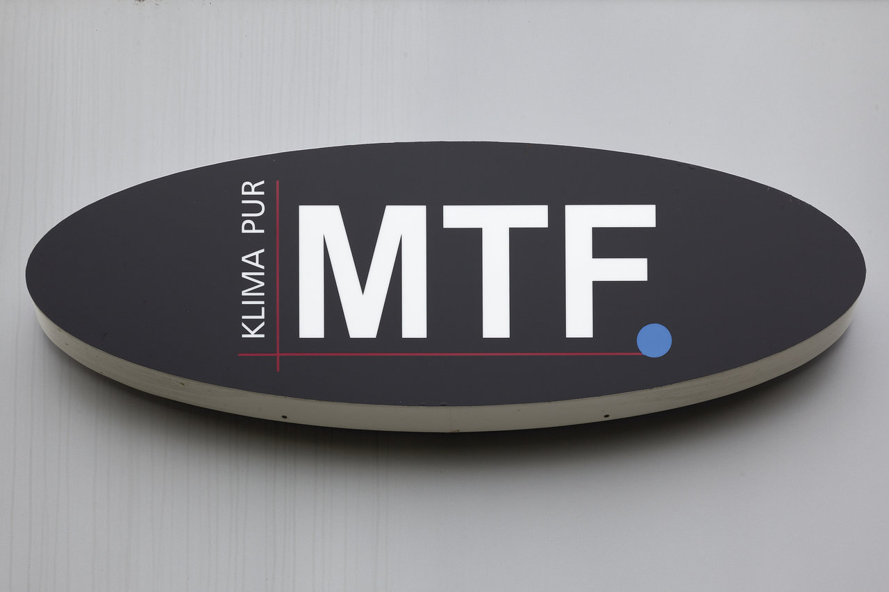 Oval company sign: 'MTF. KLIMA PUR' in white on dark background.