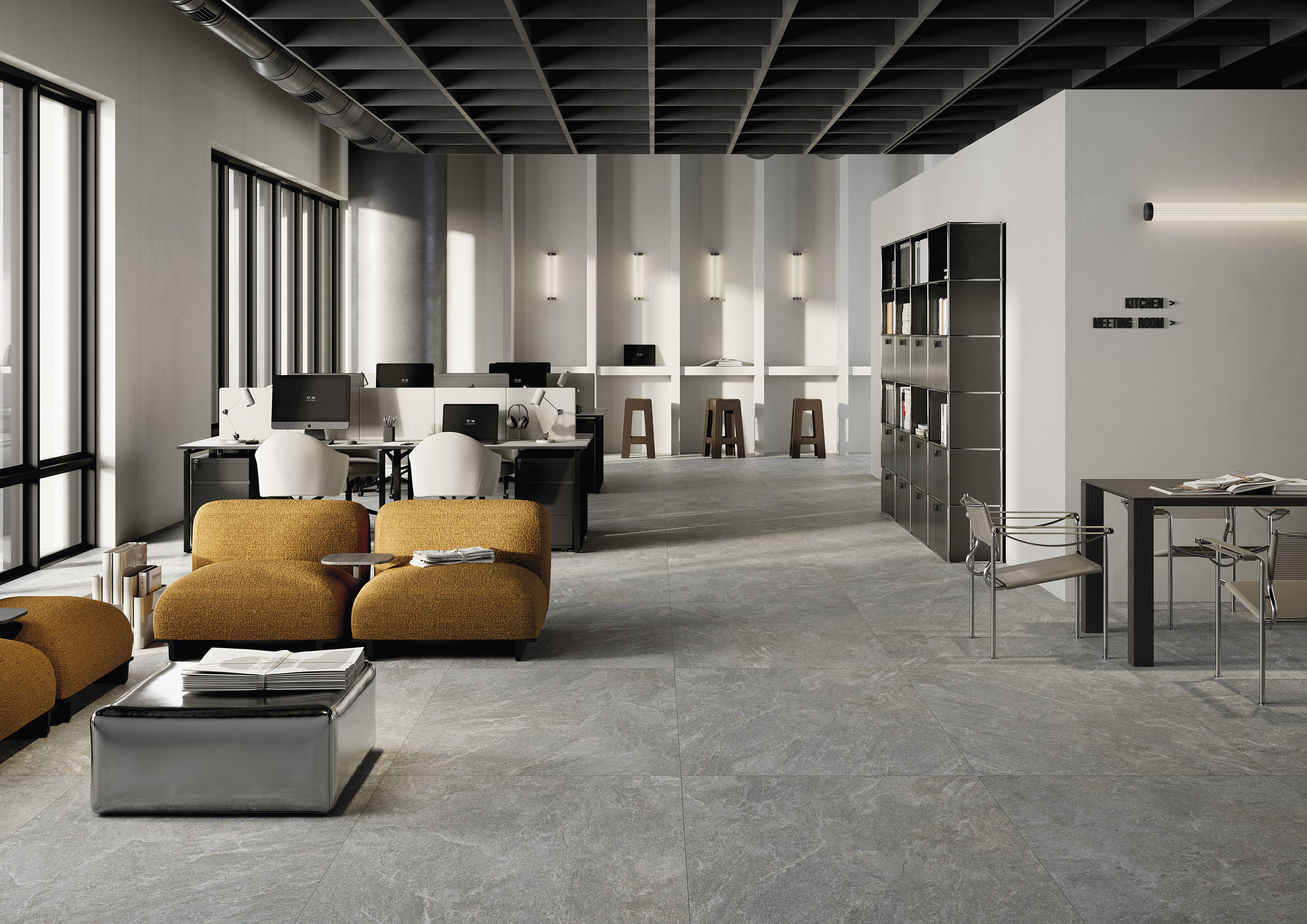 Modern open-plan office with stylish grey concrete-effect floor tiles.