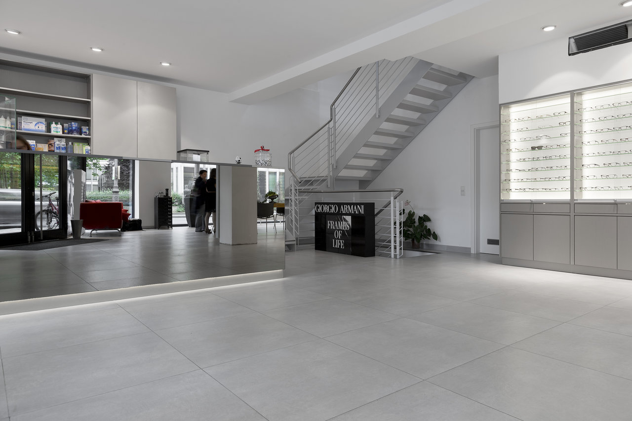 Bright, large-format tiles in a modern entrance area.