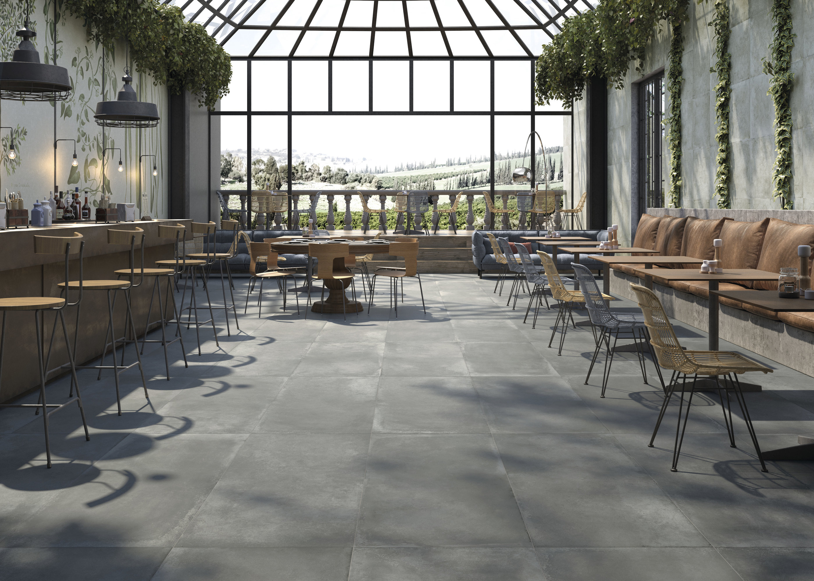 Dark grey floor tiles in a modern restaurant with a bar and abundant natural light.