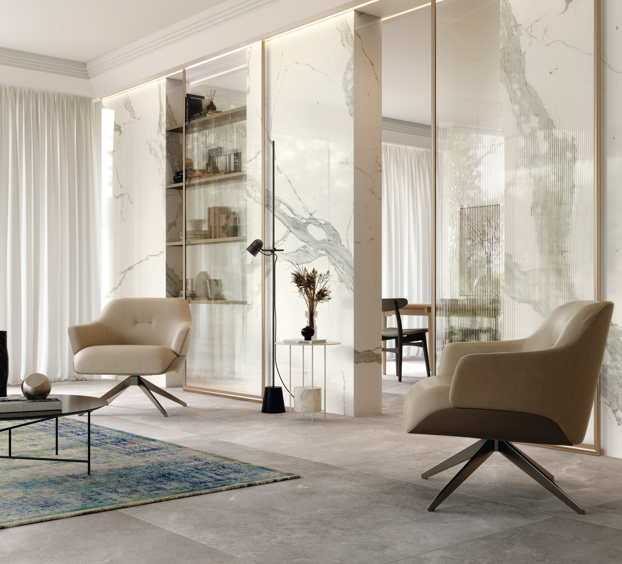 Modern living room with light grey floor tiles and large-format marble-look wall tiles.