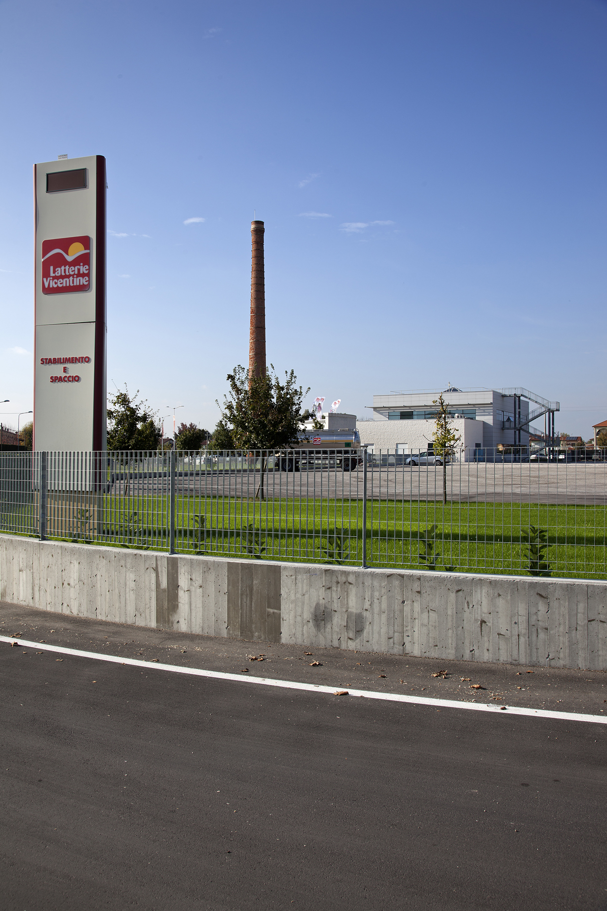 Tile factory with chimney and 'Ceramiche e Gres' sign.