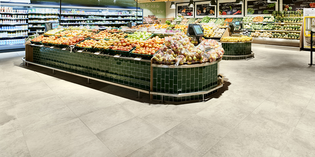 Robust, bright floor tiles in a modern supermarket.