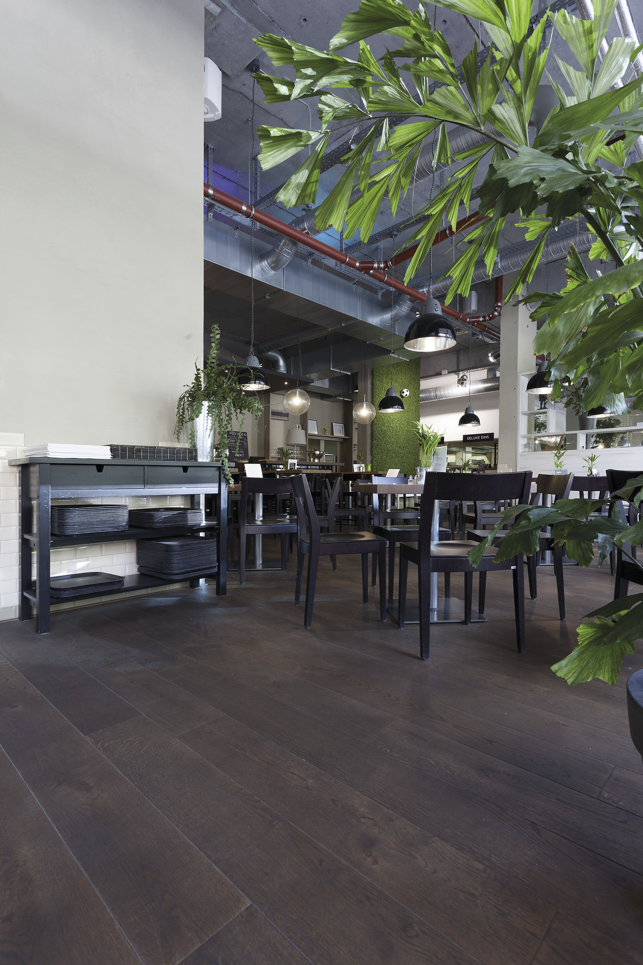 High-quality dark wood-look tiles in a modern restaurant.