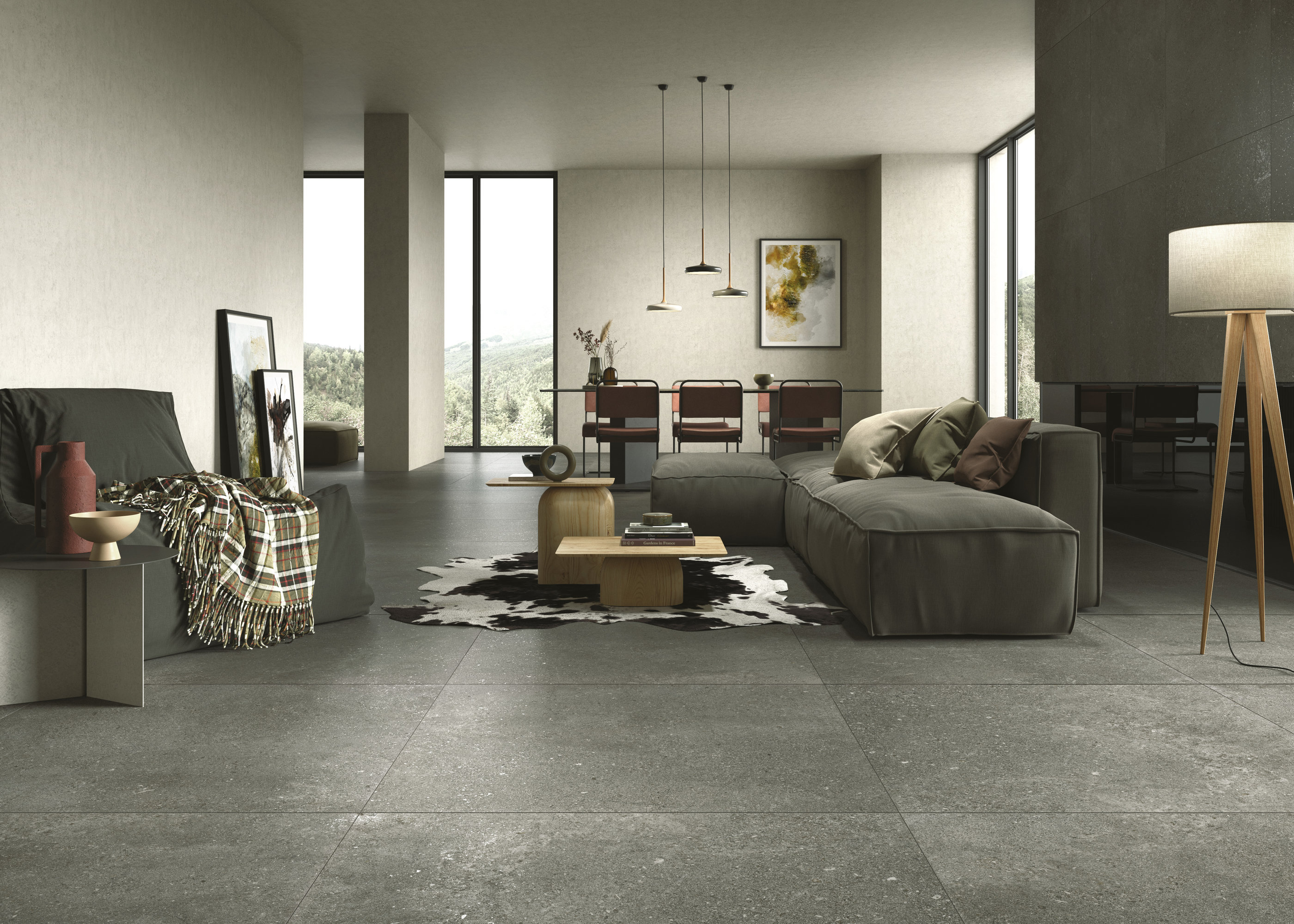 Modern living room with large-format, dark grey floor tiles by Porcelaingres.