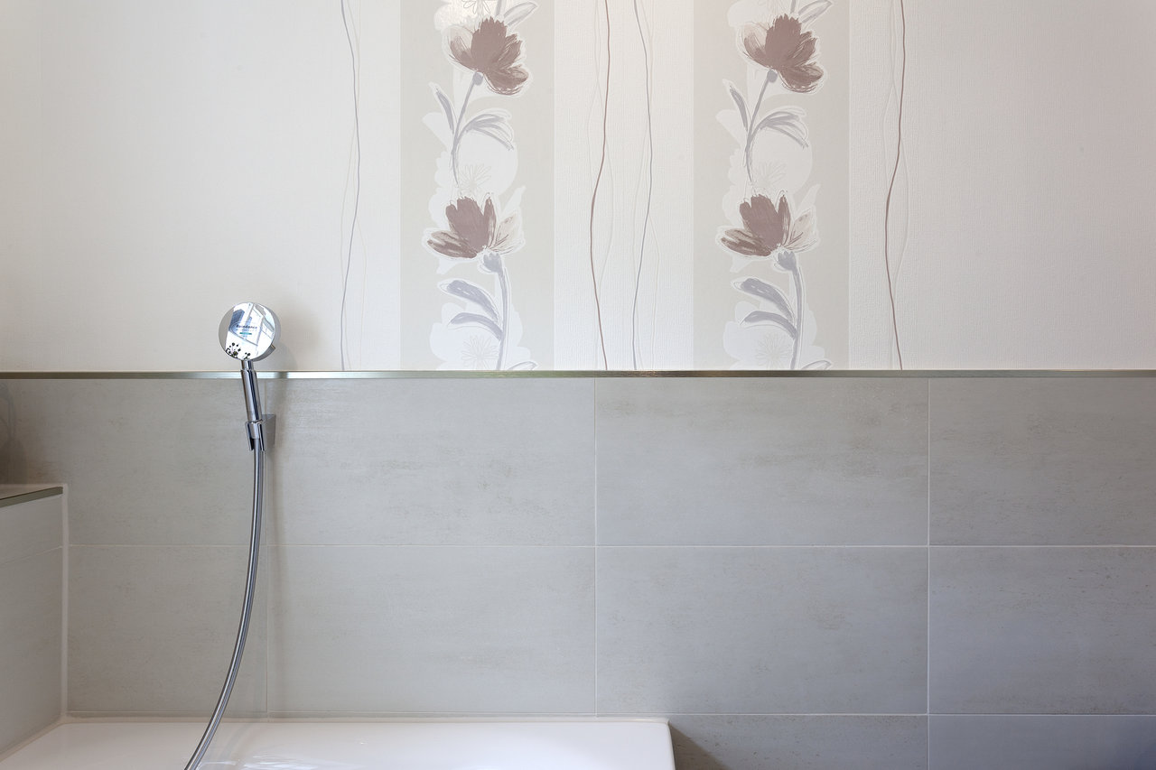 High-quality light grey tiles for a modern bathroom.