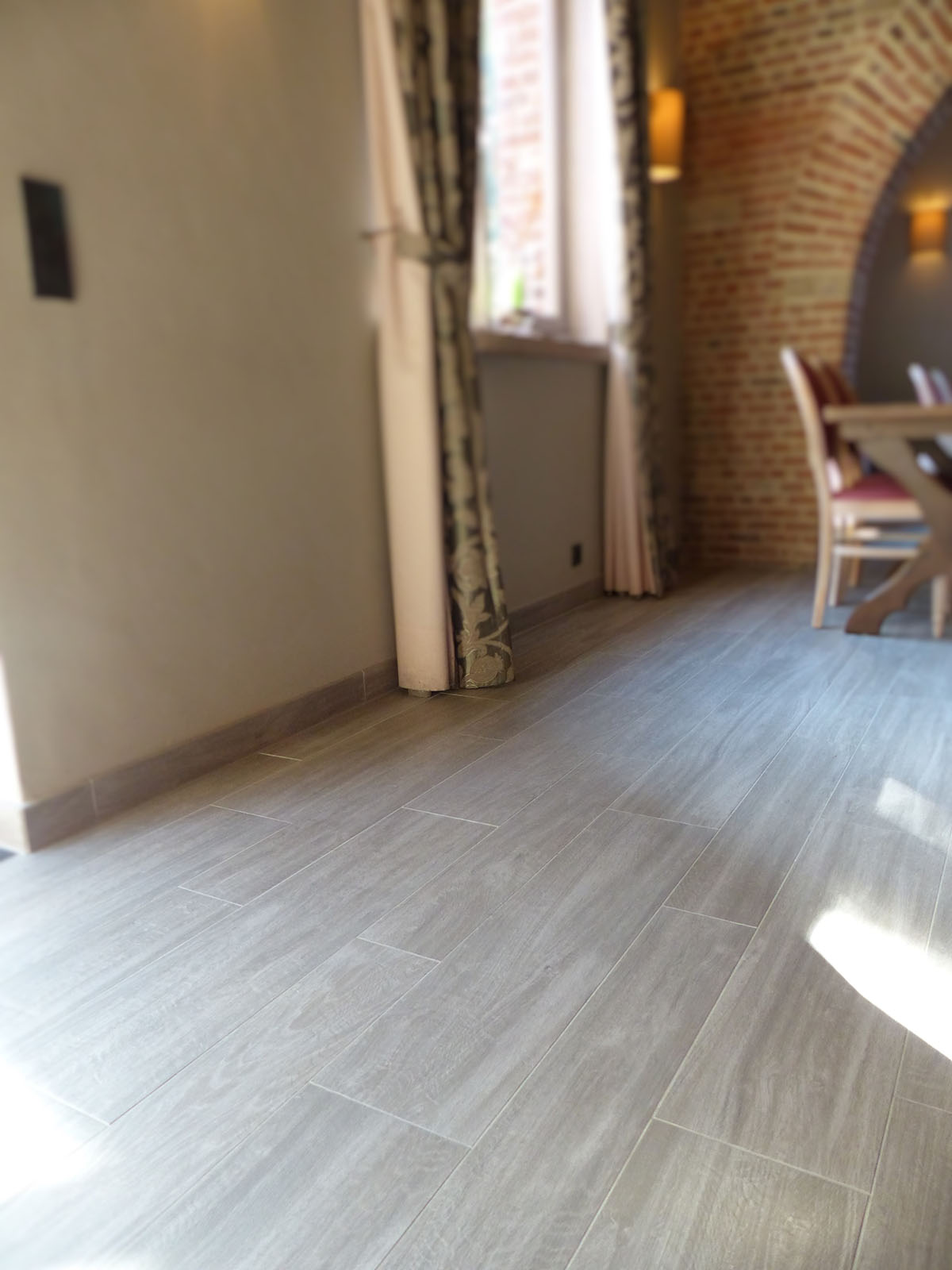 Elegant grey floor tiles in a stylish living space.