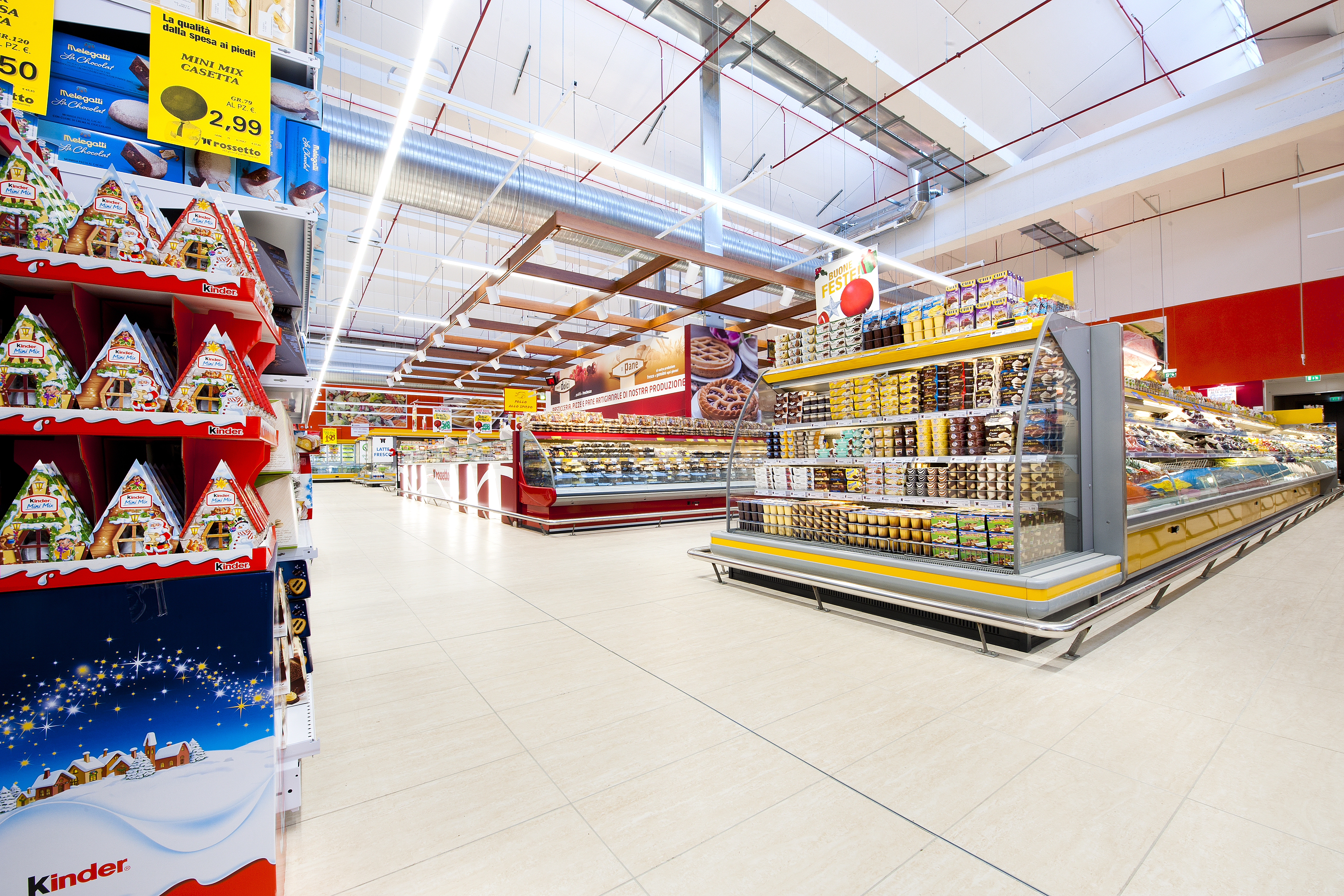 Robust, pale floor tiles in a supermarket, demonstrating resilience for busy areas.