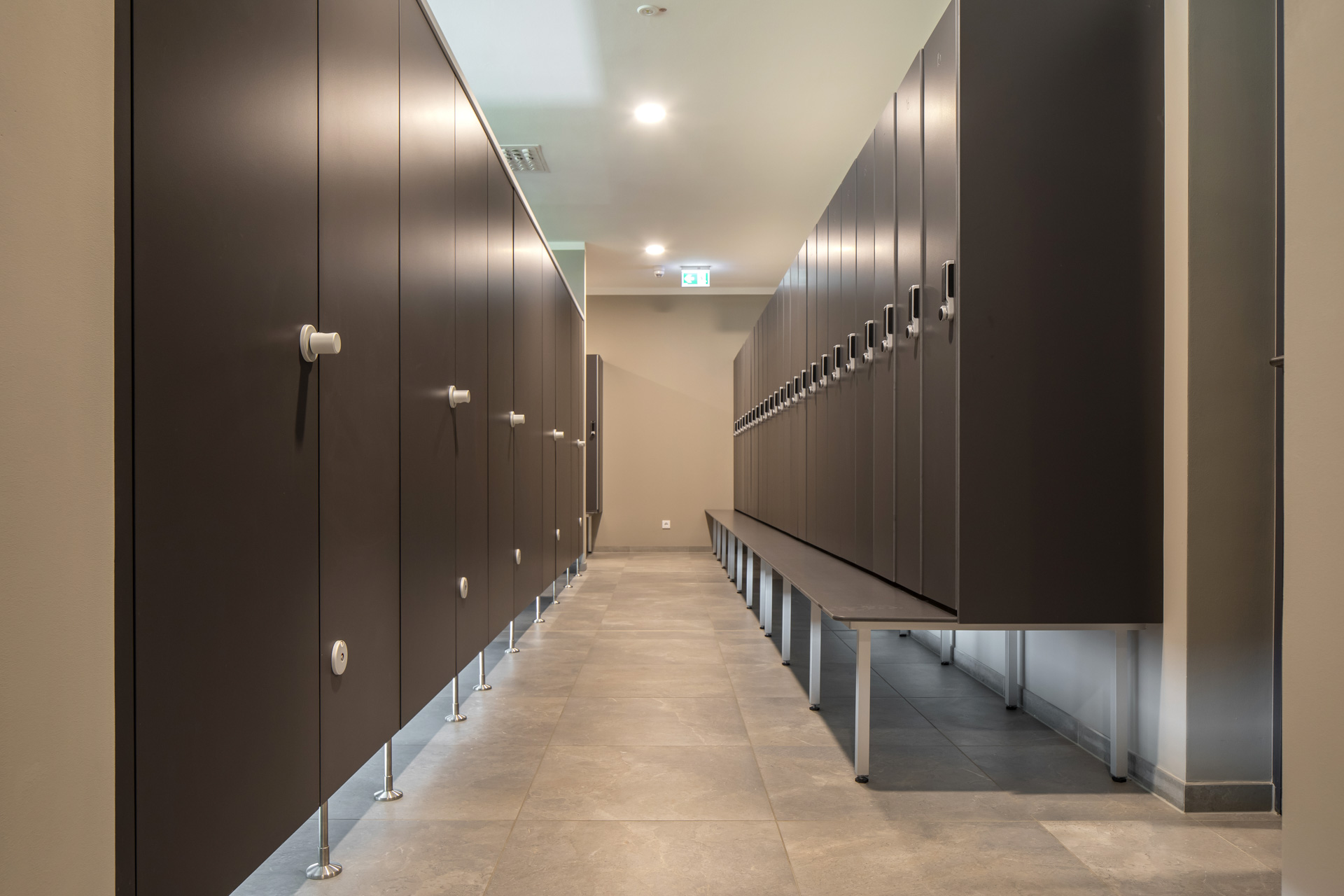 Bright changing area with high-quality floor tiles.