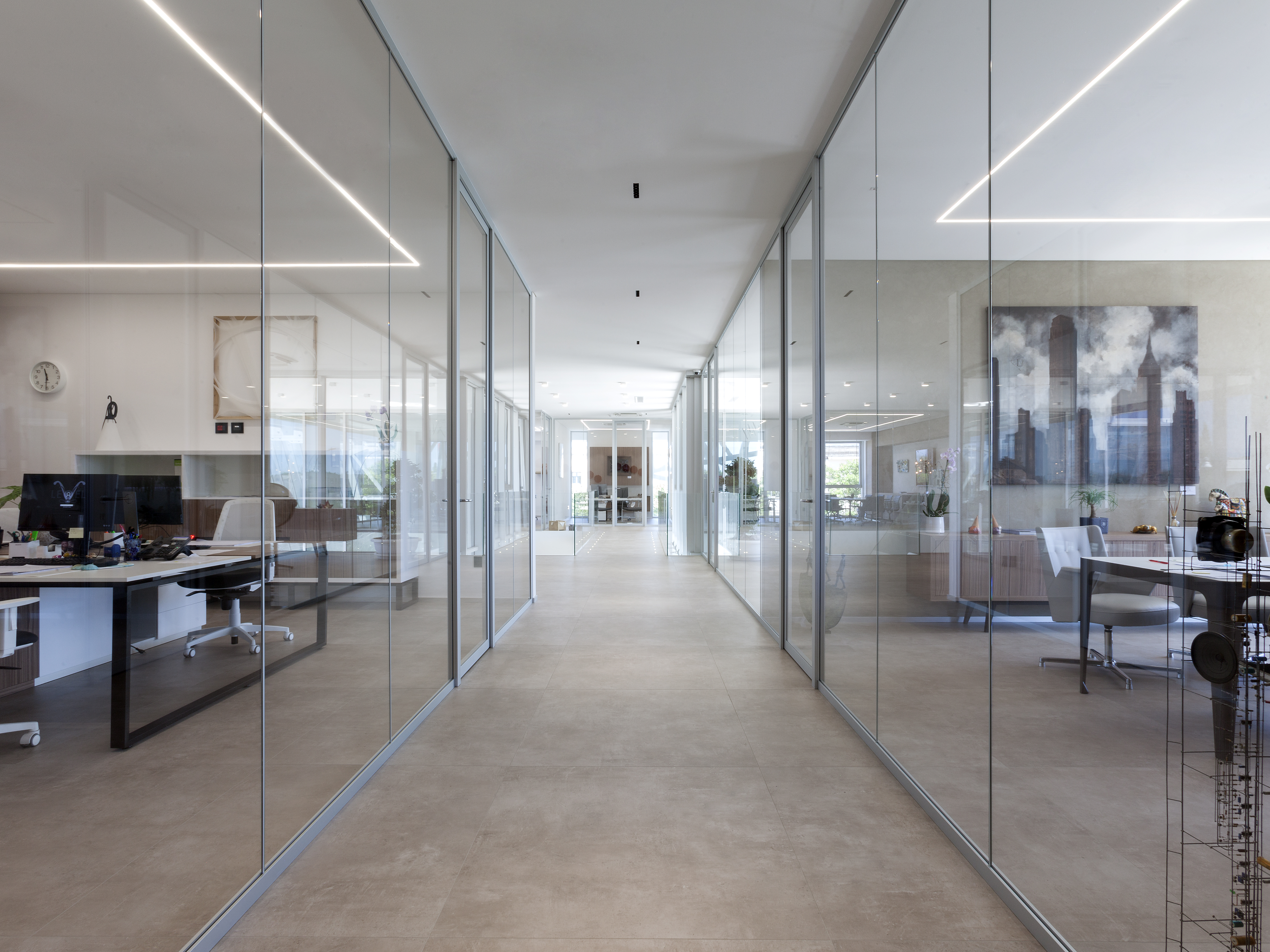 Contemporary office hallway with Porcelaingres concrete-look tiles.