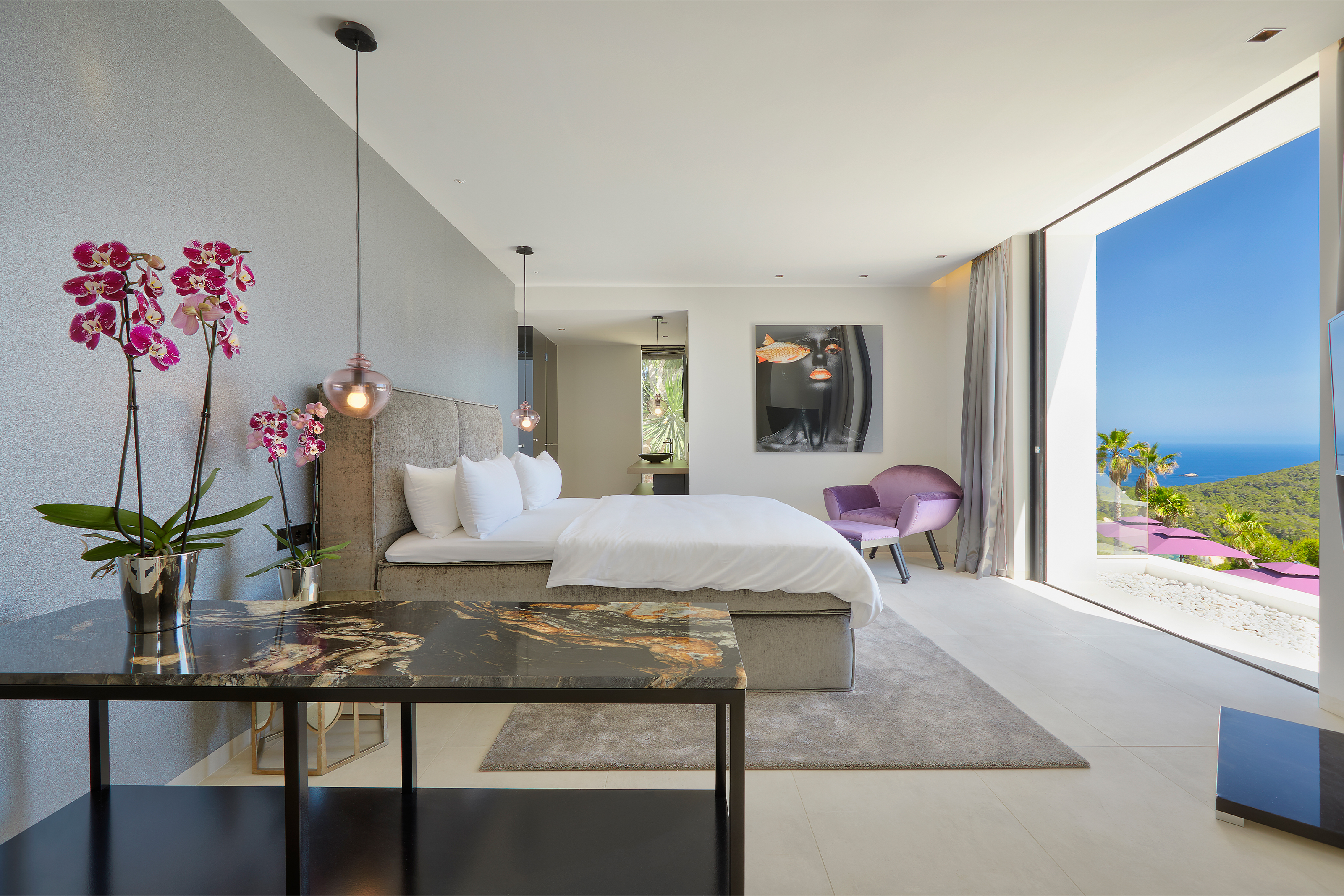 Stylish bedroom with high-quality tiles and breathtaking sea view.