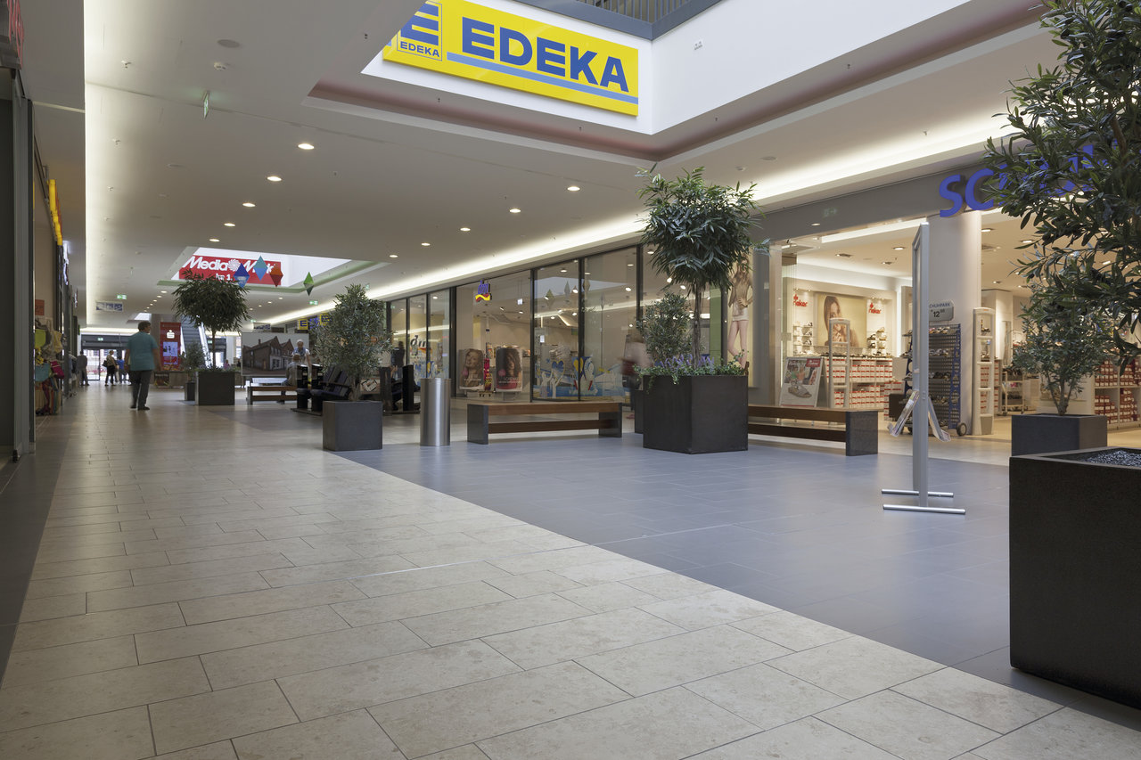 Light and dark floor tiles in a modern shopping mall.