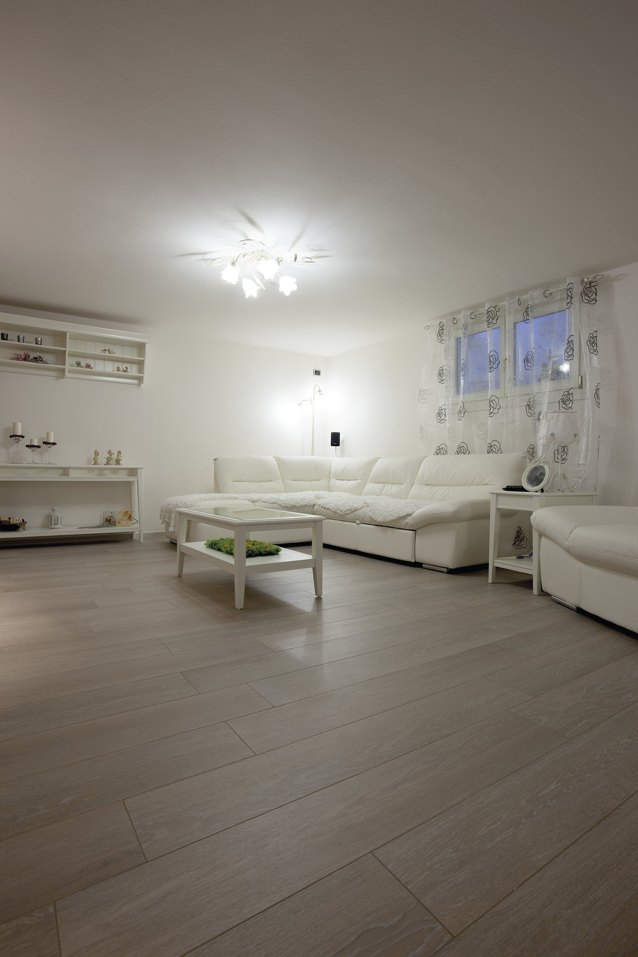 Bright living room with modern wood-look tiles.