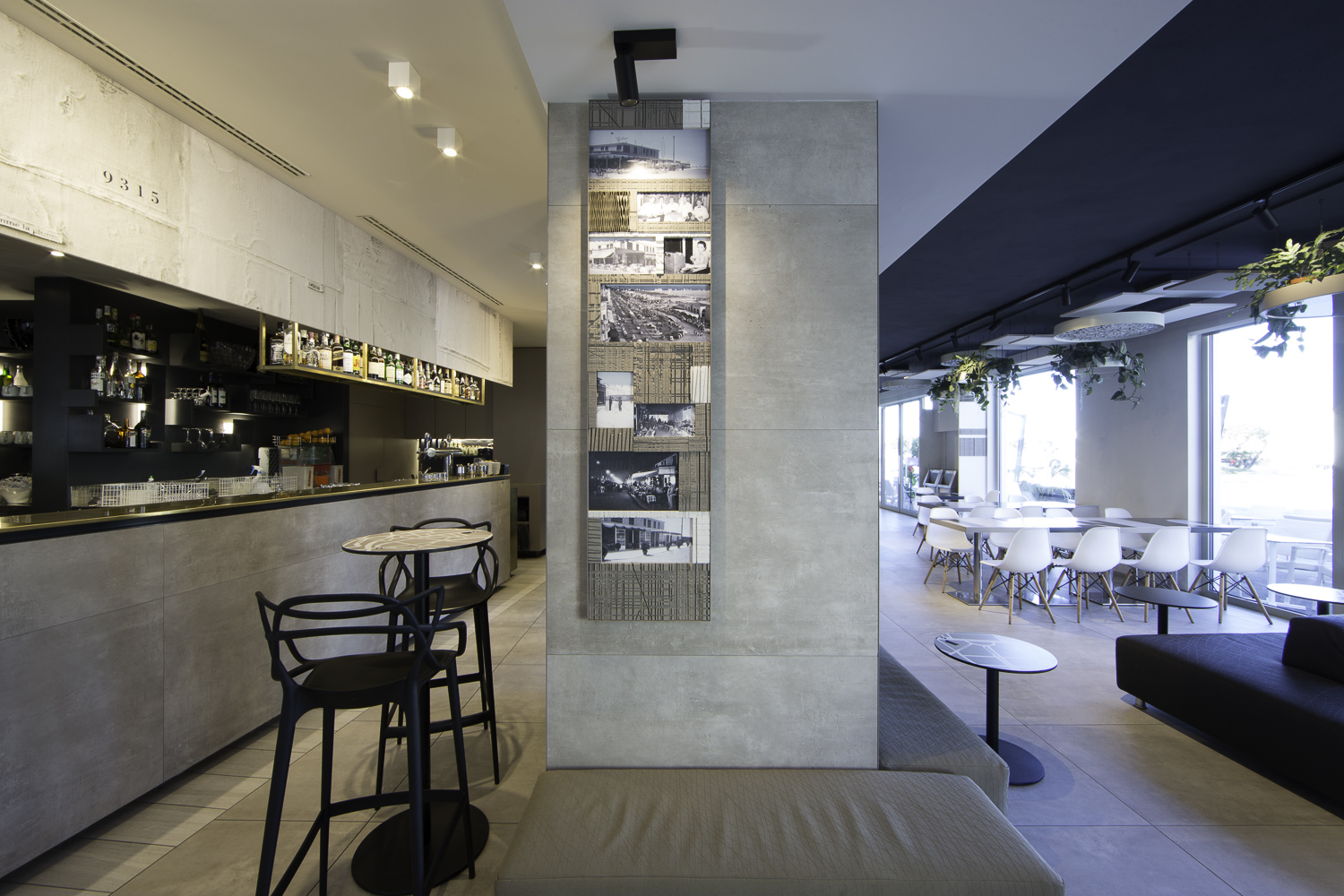 Stylish interior with Porcelaingres concrete-look tiles on walls and counter.