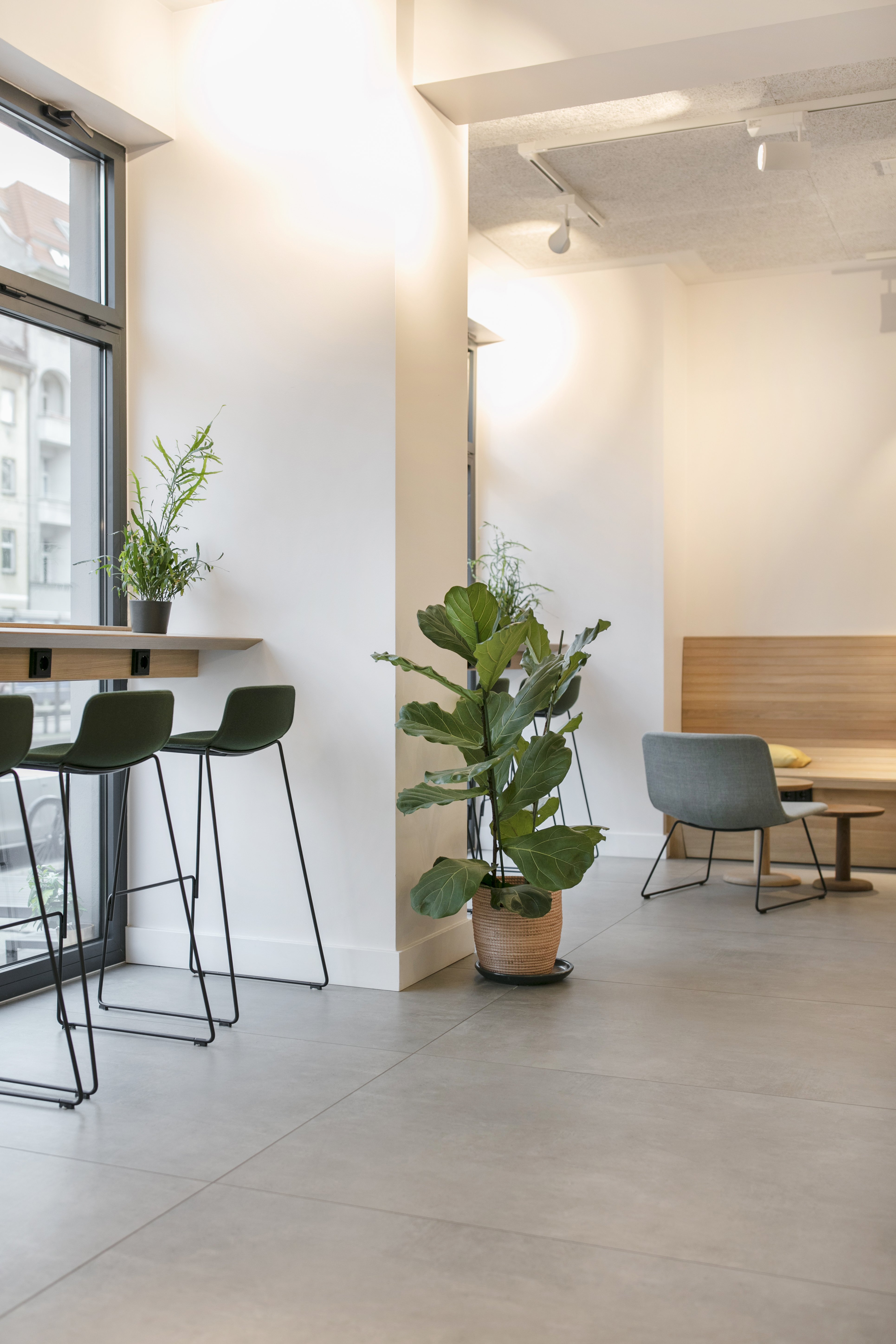 Light, large-format concrete-effect floor tiles for modern interiors.