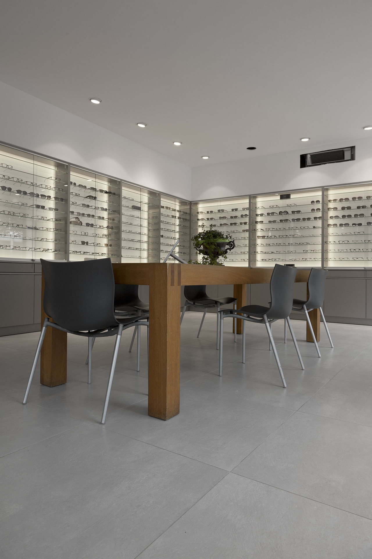 Timeless, light grey large-format floor tiles in a modern shop.